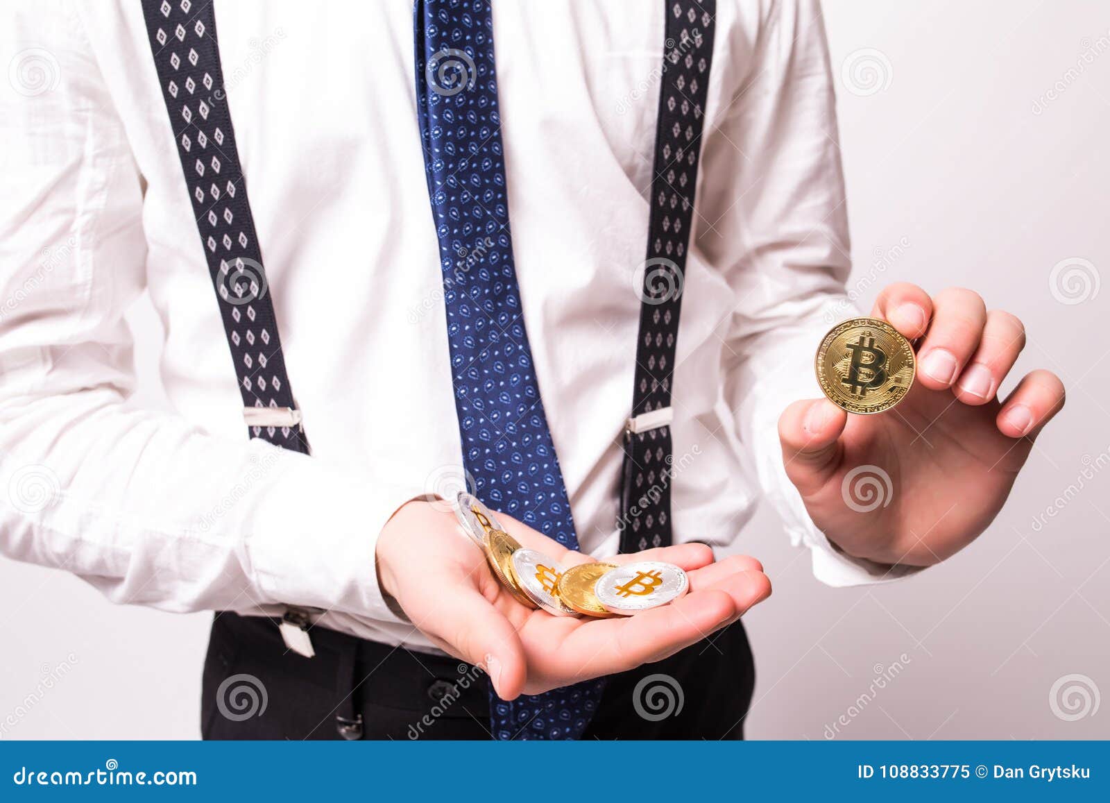close up of bitcoin in open hand  on white background.