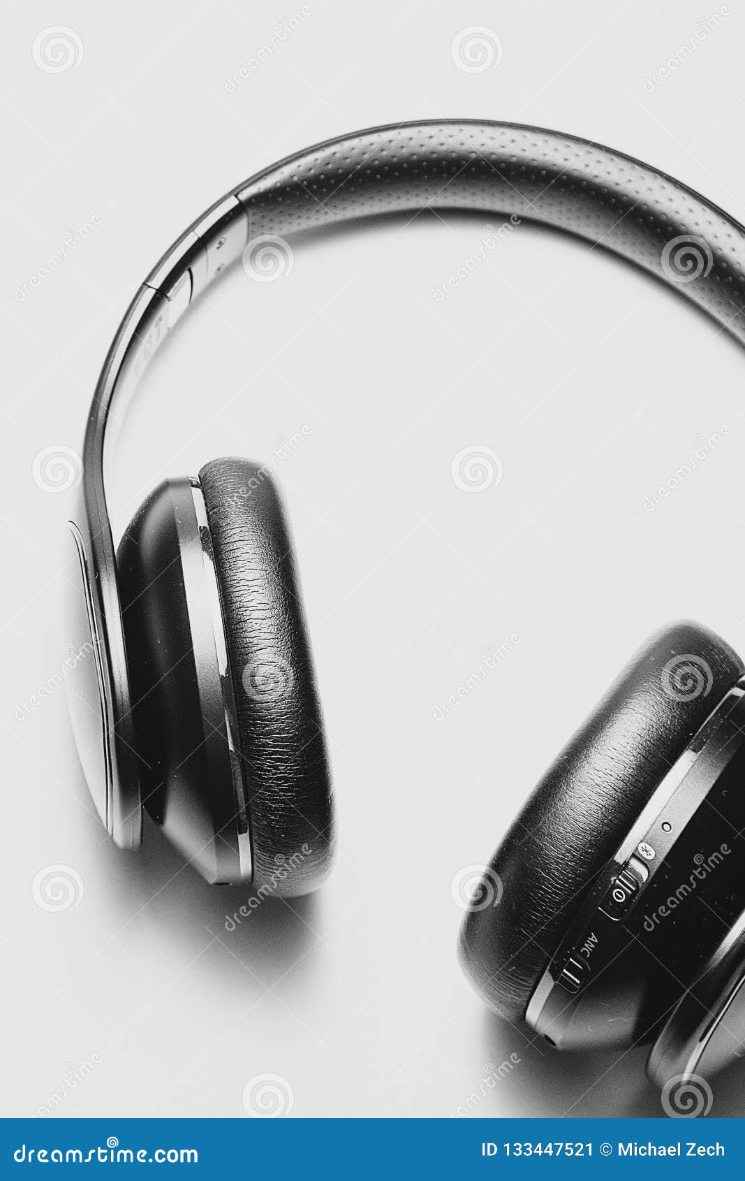 Close Up of Black Headphones Lying on a White Table Stock Image - Image ...