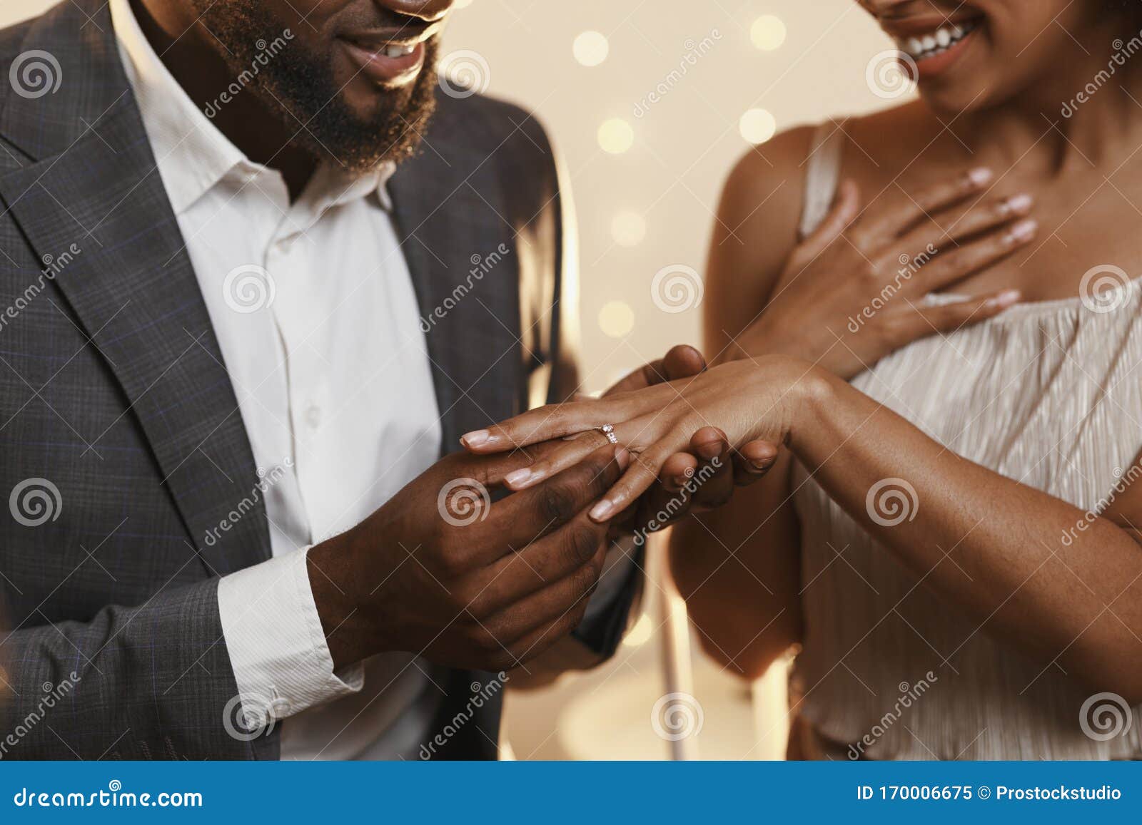 Black Man Putting Ring On His Woman Finger Stock Image