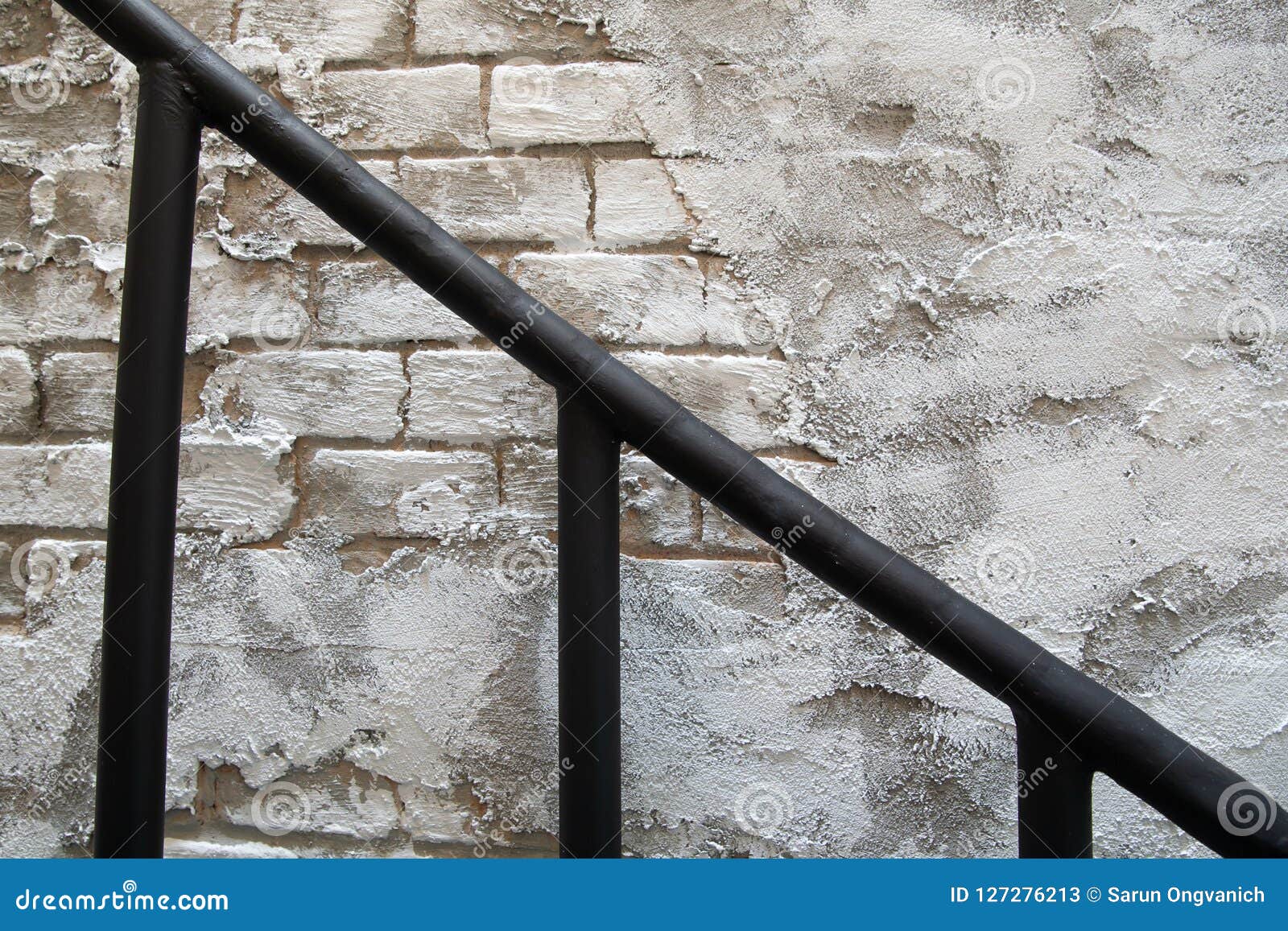 Close Up Of Black Metal Staircase Railing On Broken Old