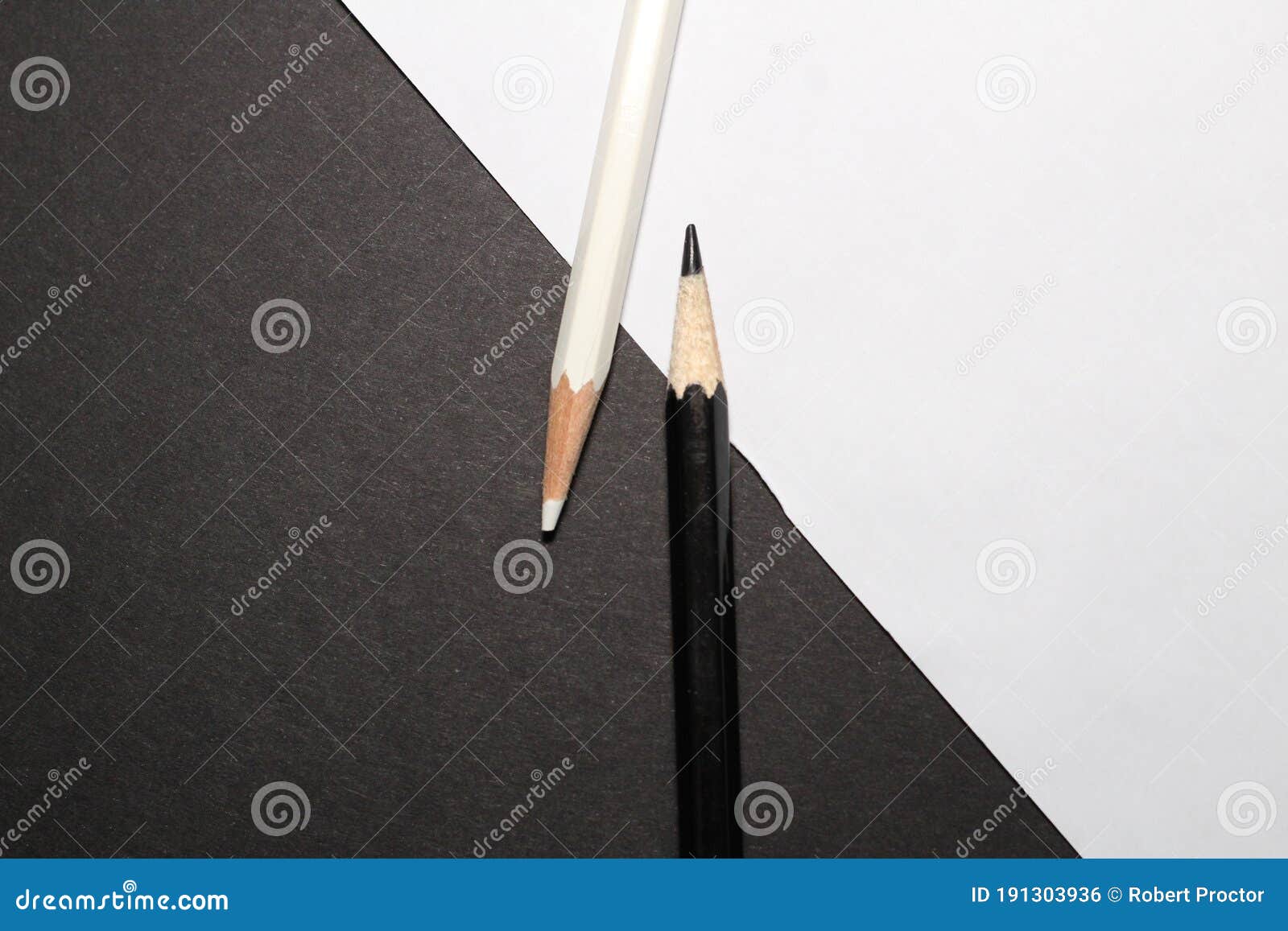 Closeup of Black and White Colored Pencils on Black and White