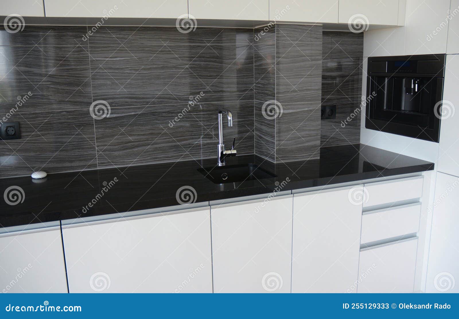Closeup on a Black and White Kitchen Table with Kitchen Sink and a