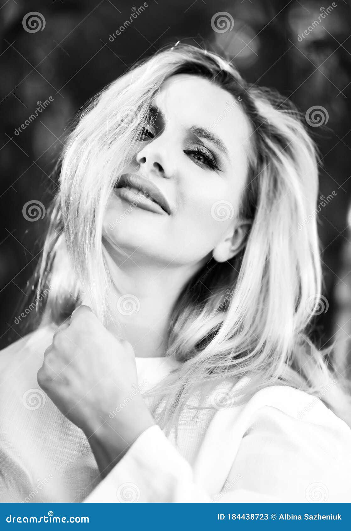 Close-up Black and White Vertical Portrait of Beautiful Blonde Sexual 30 Years Old Woman with Make-up, Wild Hair and Hand Near Stock Image image