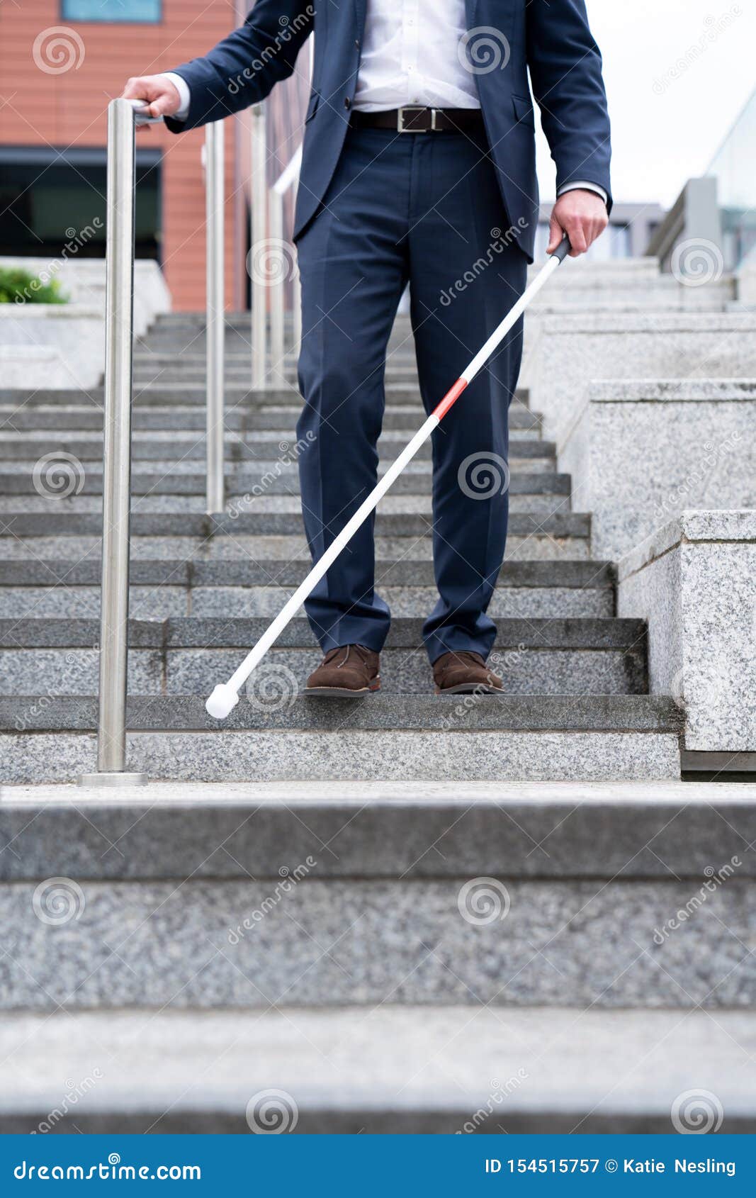Close Up of Blind Person Negotiating Steps Outdoors Using Cane