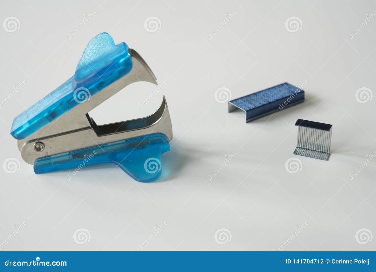 Close Up Blue Anti Stapler For Removing Staples On A White