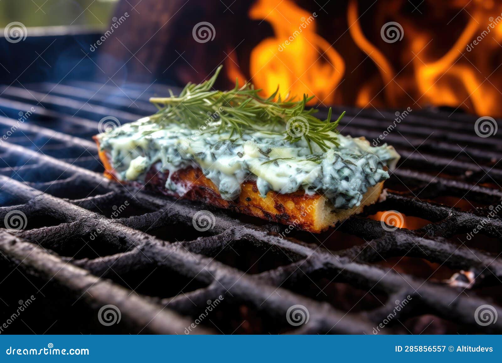 Closeup of Blue Cheese Melting on Cedar Plank Over Grill Stock Image