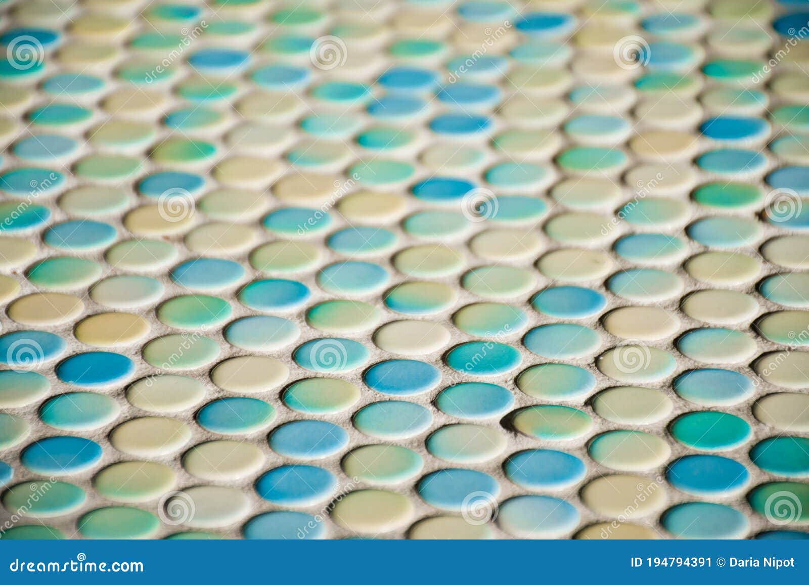 close up of blurred round colorful tiles - yellow, tourquise and blue