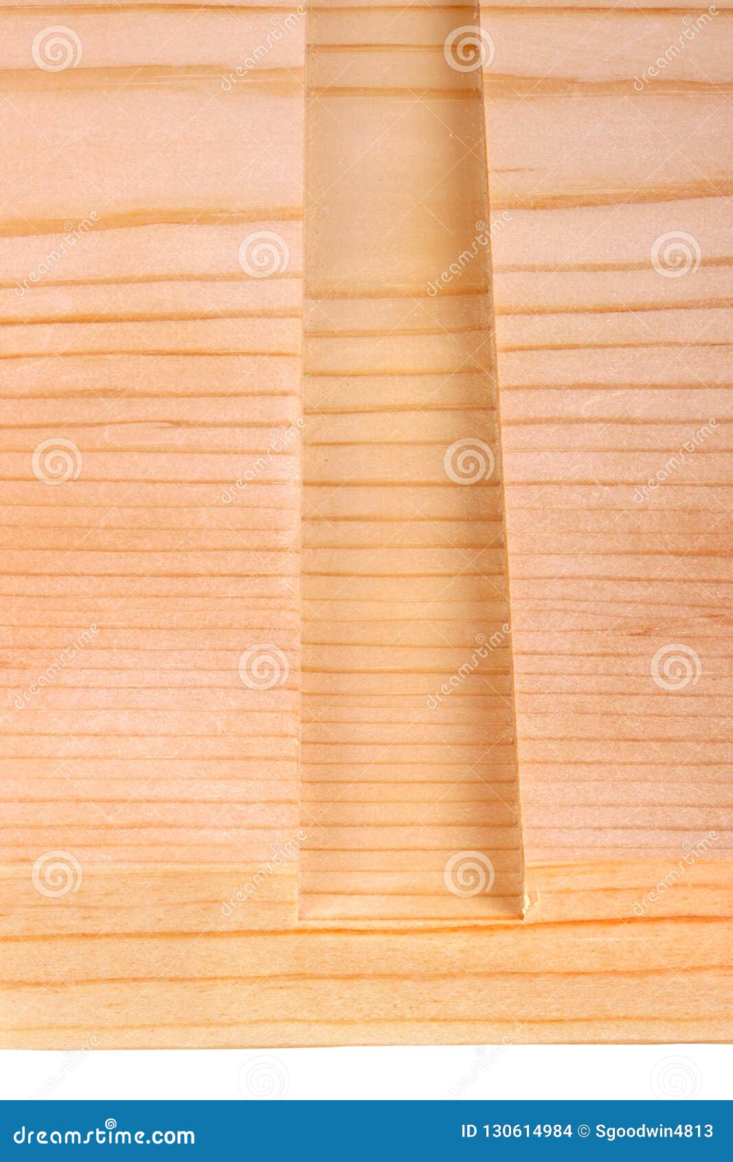 close-up of a board with a woodworking dado groove  vert