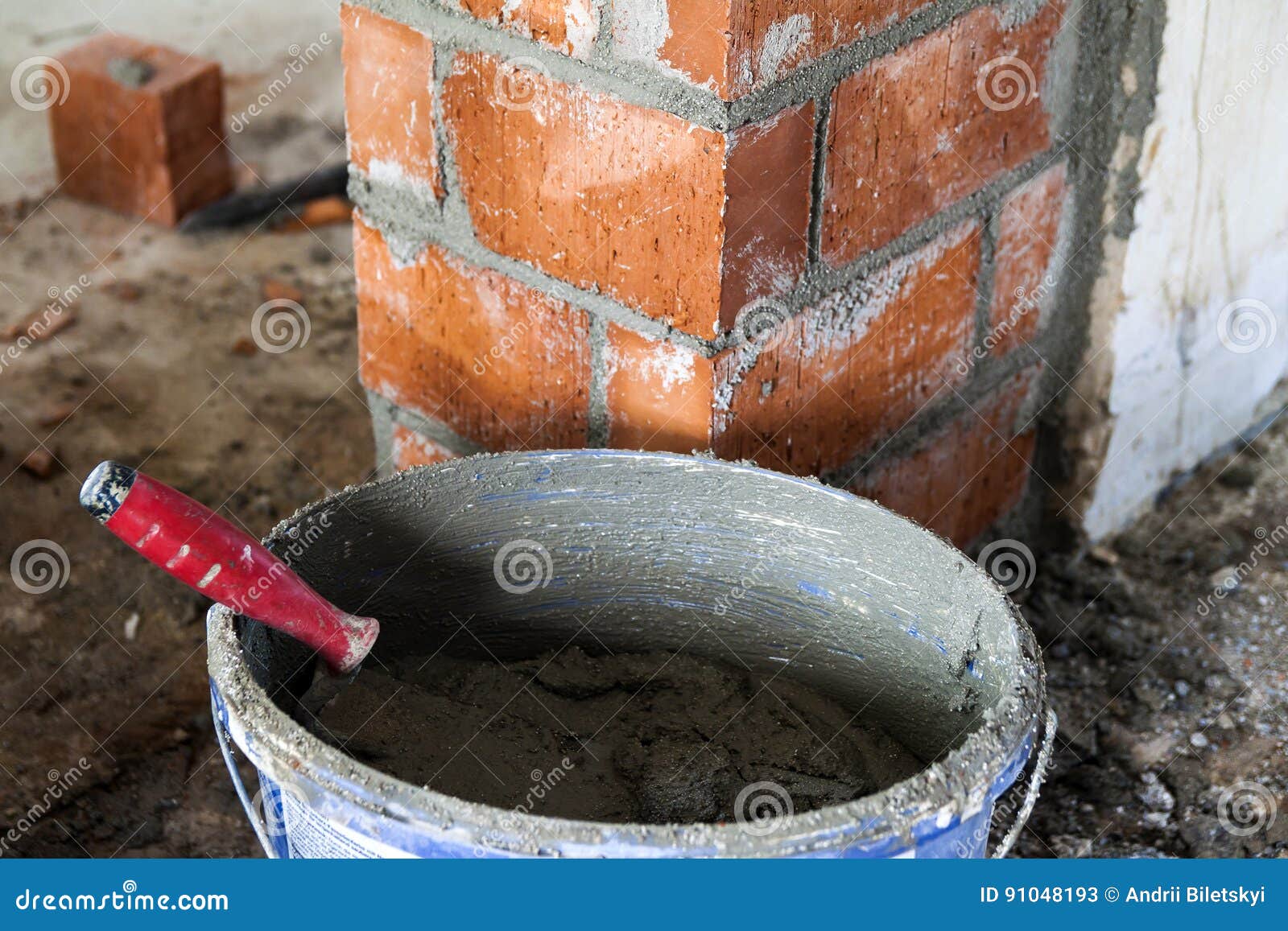 Close Up of Bricklaying Industrial Installing Bricks on Construction