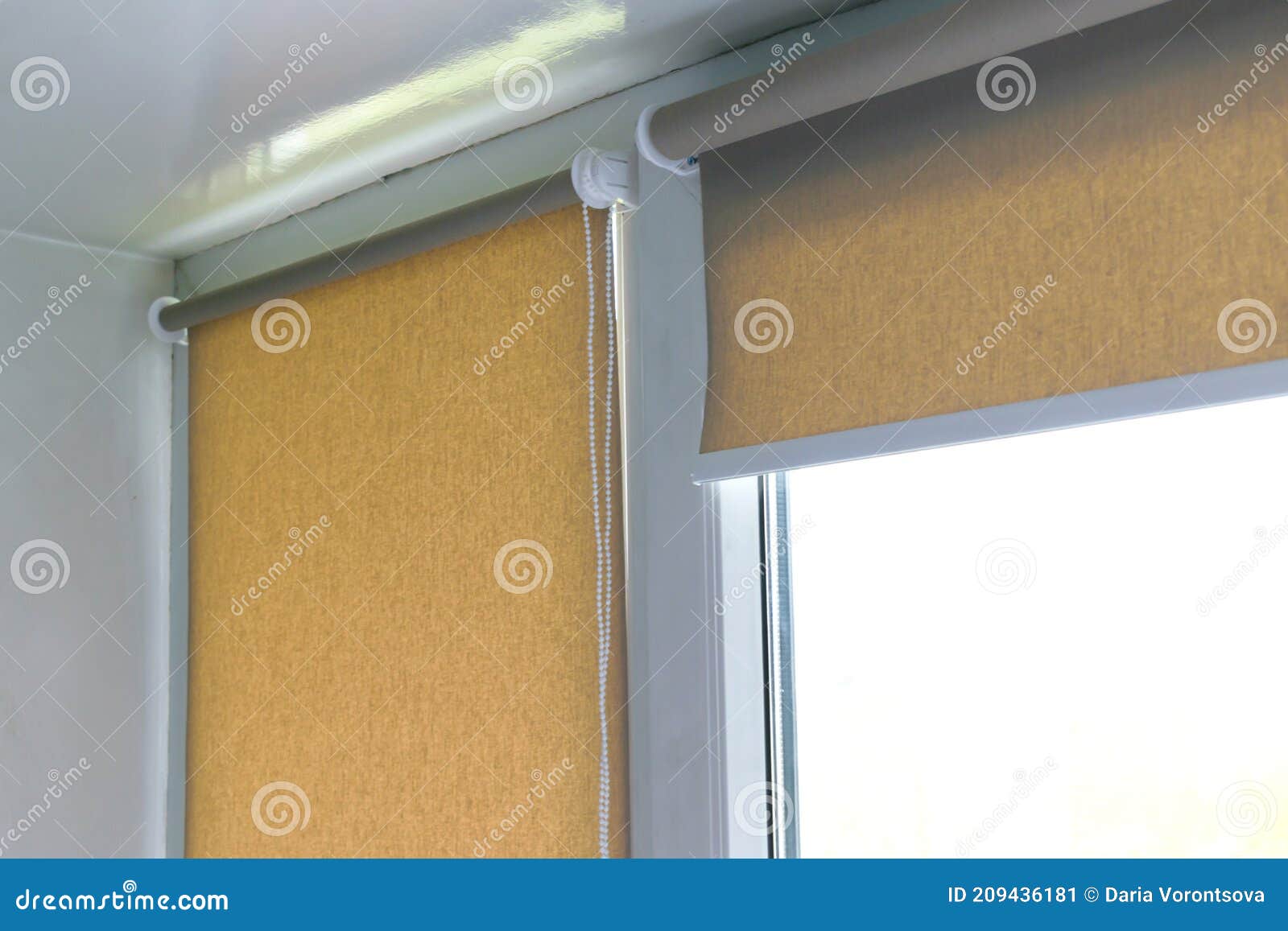 Close Up of Brown Roller Blinds, Shades on Plastic Windows at Home