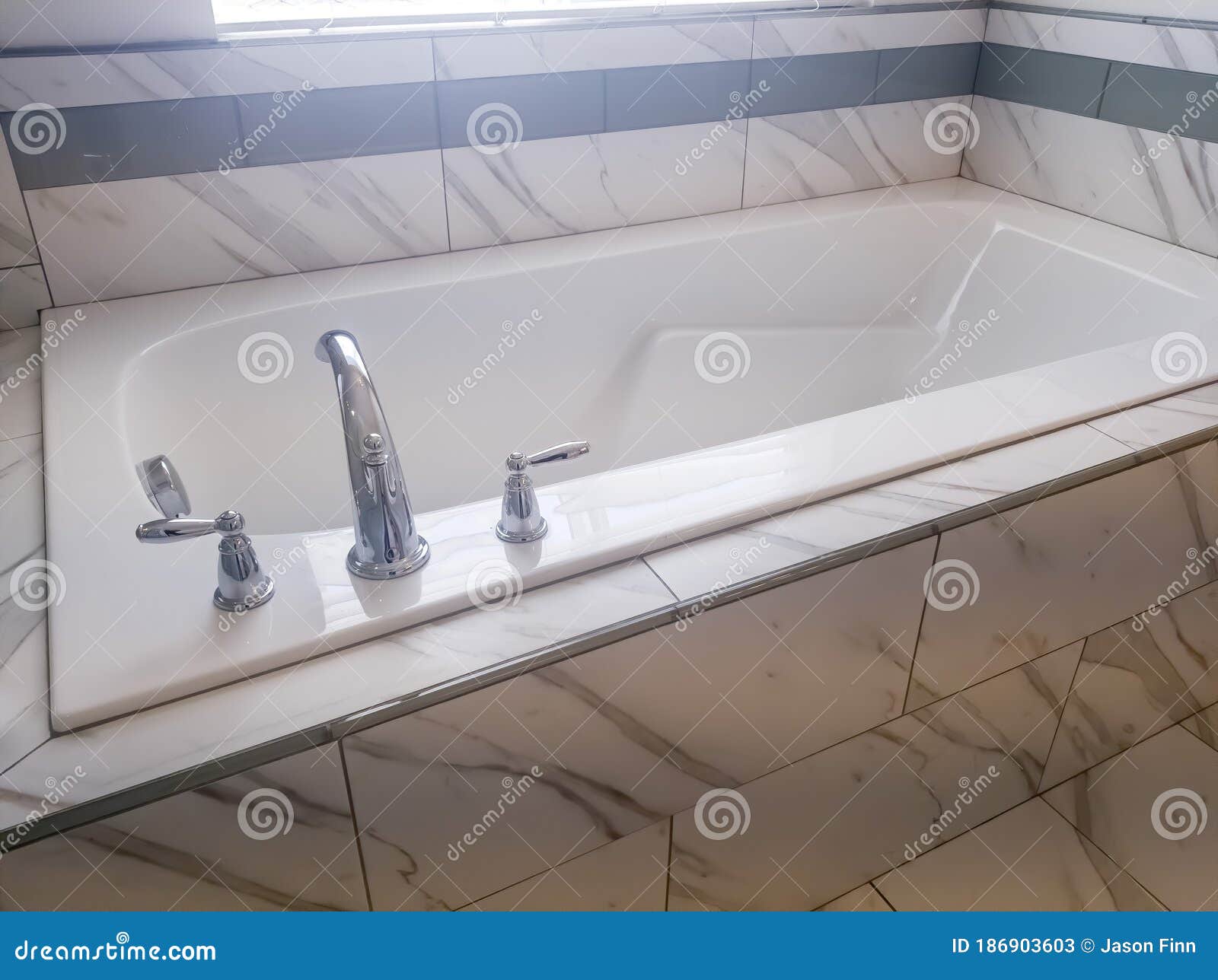 Close Up Of Built In Rectangular Bathtub With Stainless Steel Faucet And Handles Stock Image Image Of Steel Handle 186903603