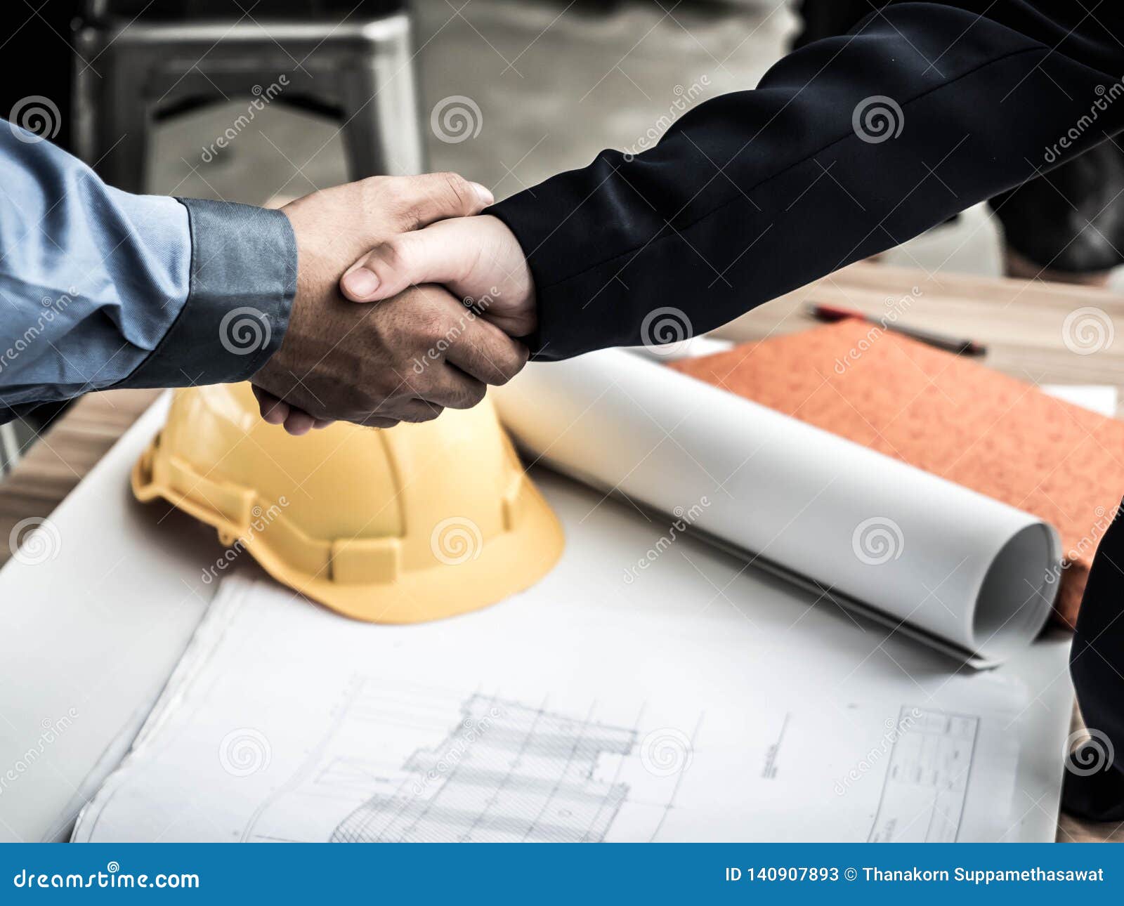 close-up of business engineer planing at construction site project, documents, worker tool