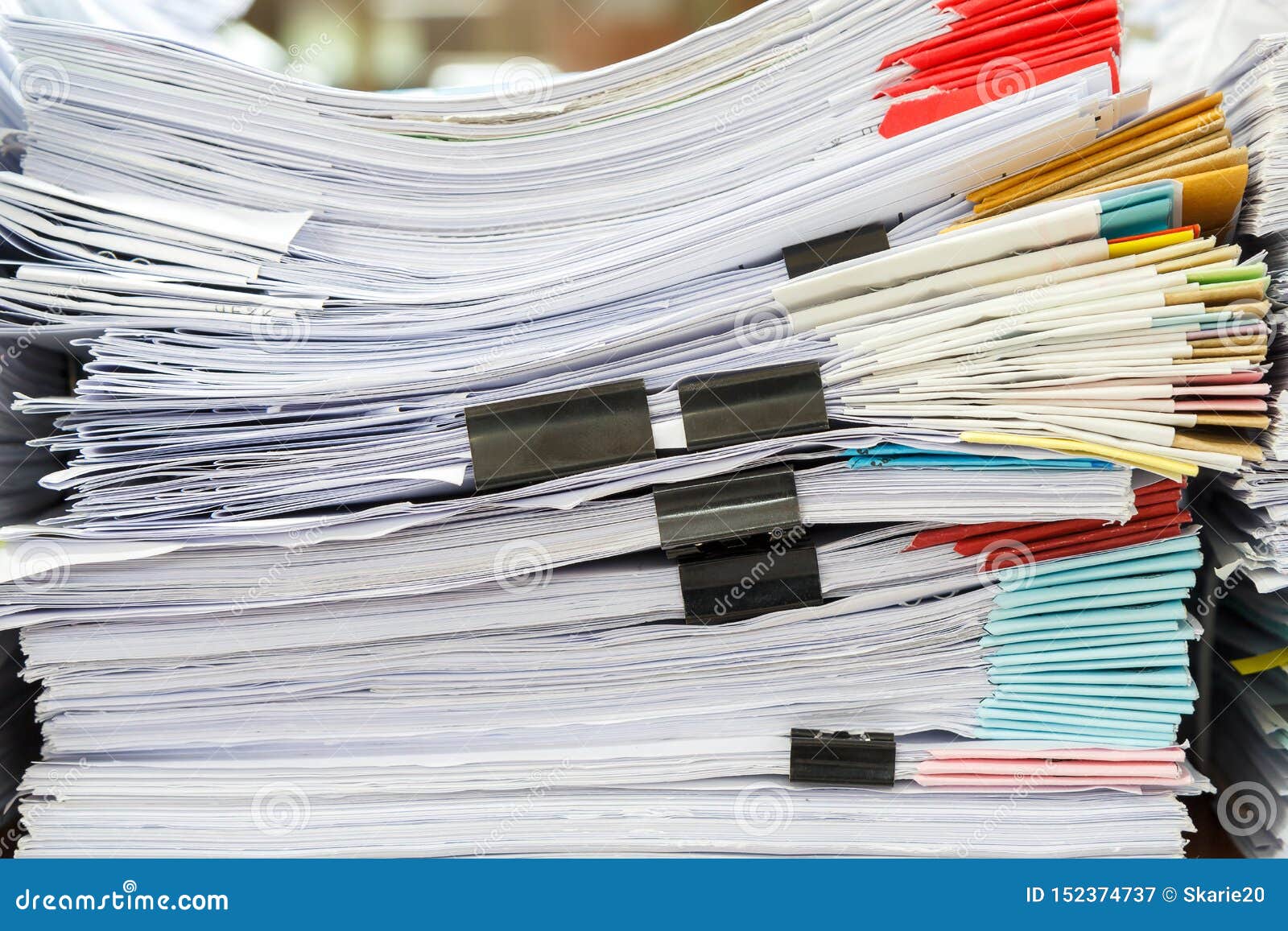 Close Up of Business Papers Stack on Desk. Pile of Unfinished Documents