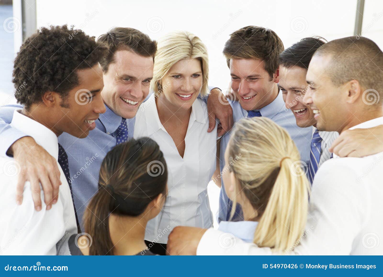 close up of business people congratulating one another in team building exercise