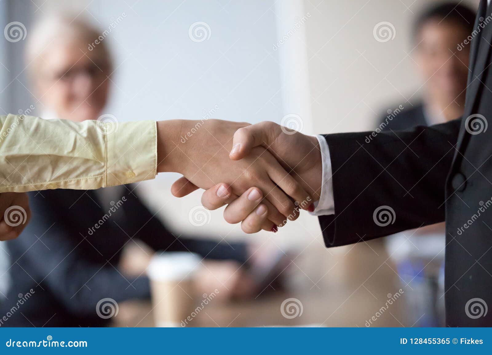 close up of businessman handshake intern greeting with promotion