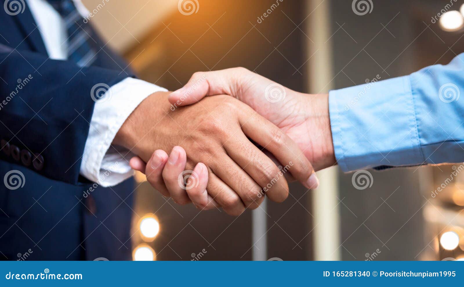 close up businessmen shaking hands during a meeting. handshake deal business corporate