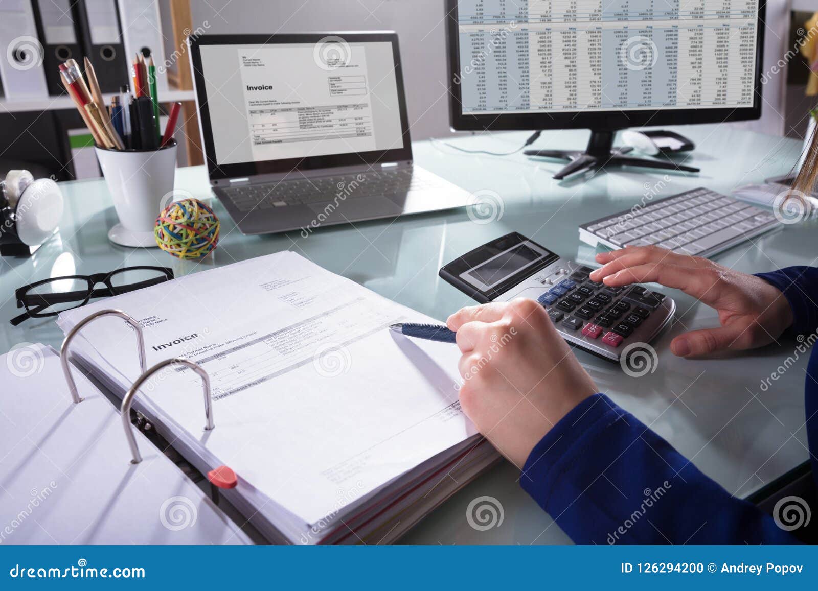 businessperson calculating invoice