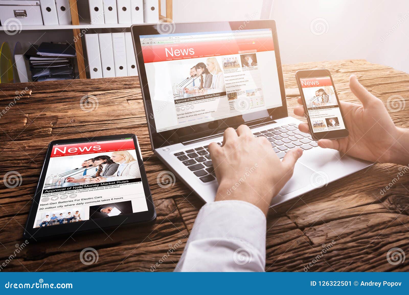 businessperson reading online news on laptop