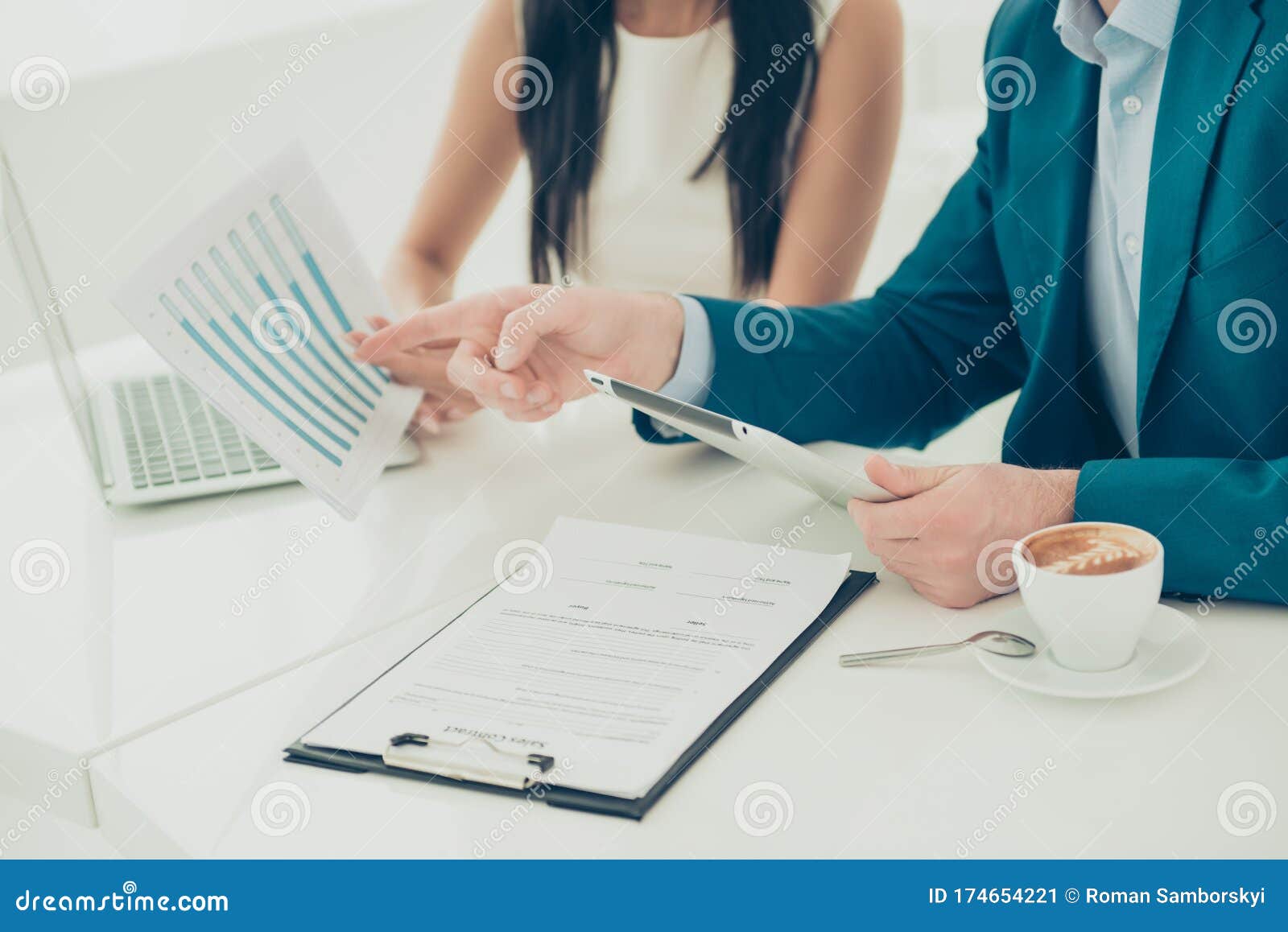 close up of businesswoman showing diagrama of financial growth to her partner