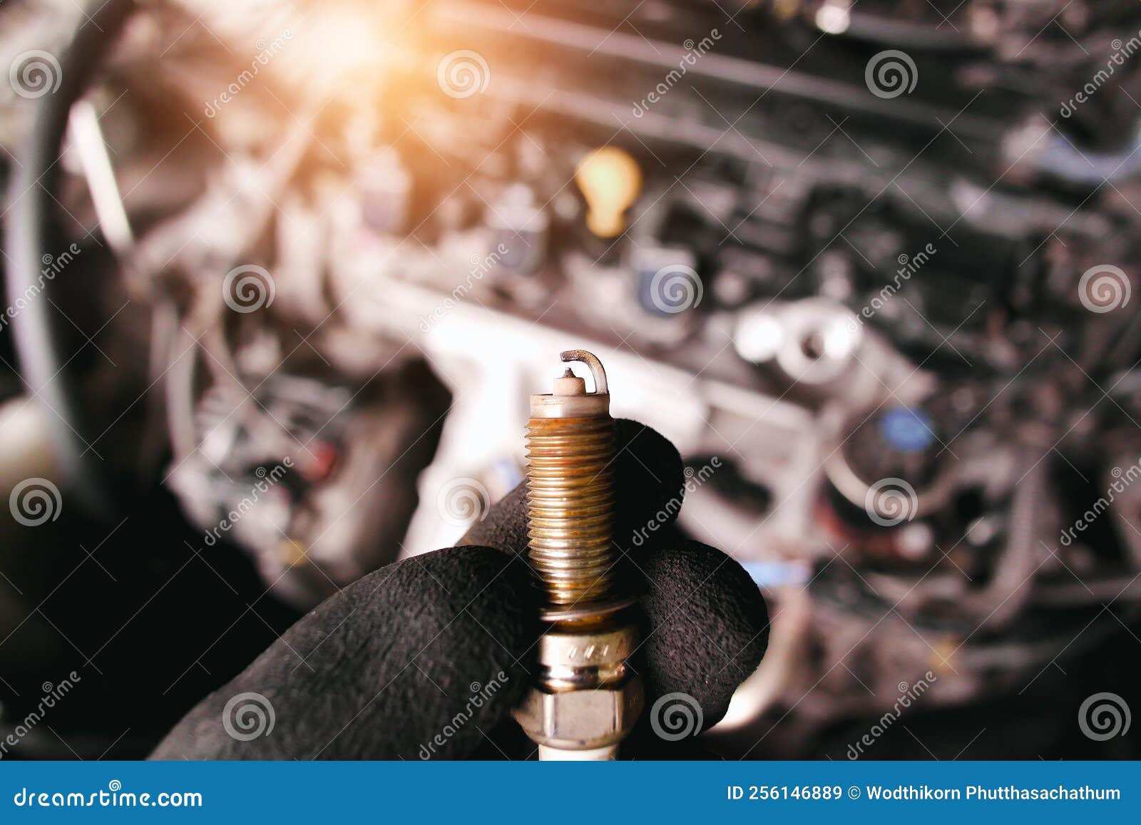Close Up of Car Iridium Spark Plugs Damaged by Heavy Use of the Car