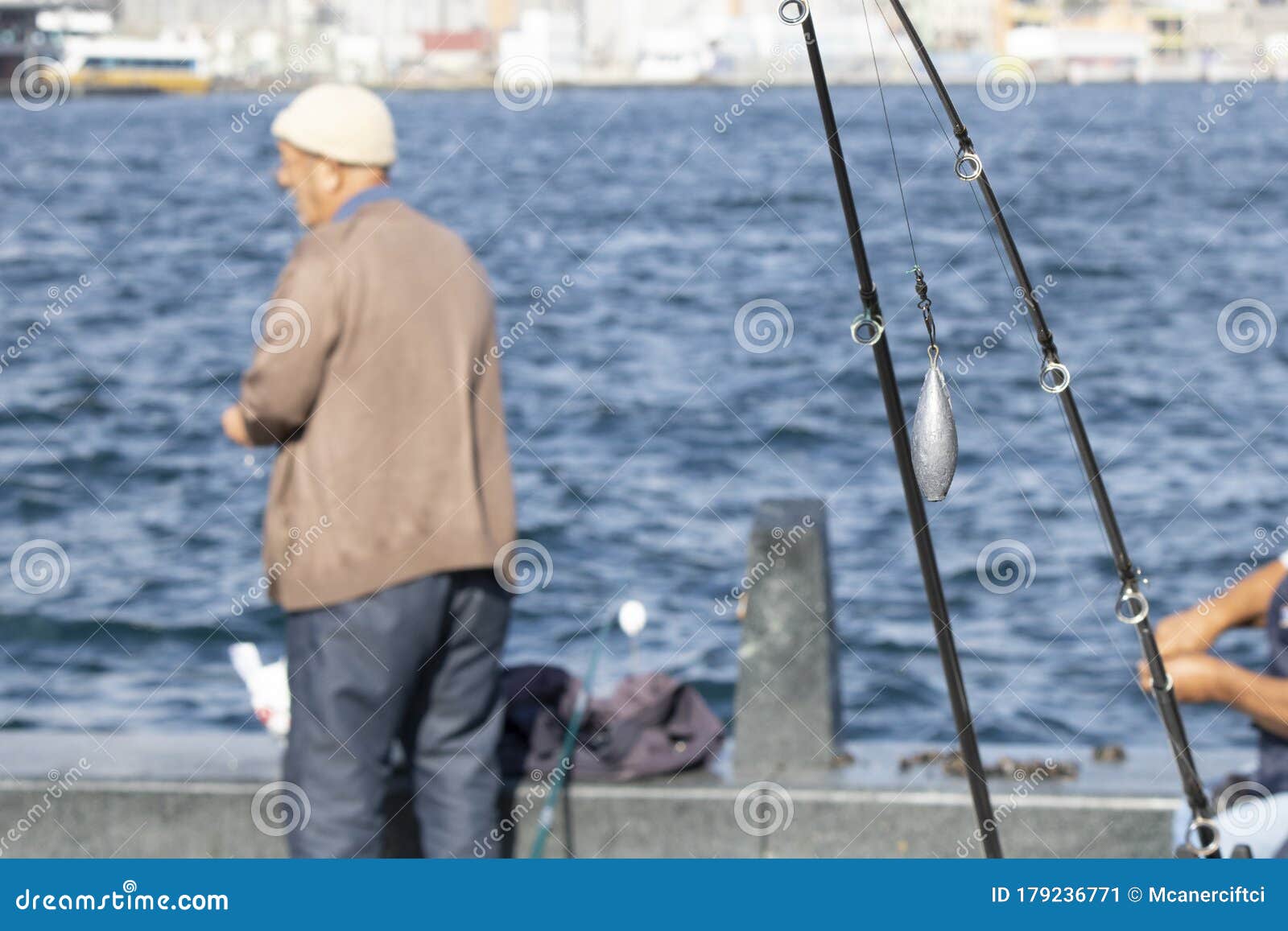 Close-up of Casting Weights that are Attached To the Tip of the Fishing Rod.  There is the Old Man and the Sea in the Background Editorial Photo - Image  of cheap, background