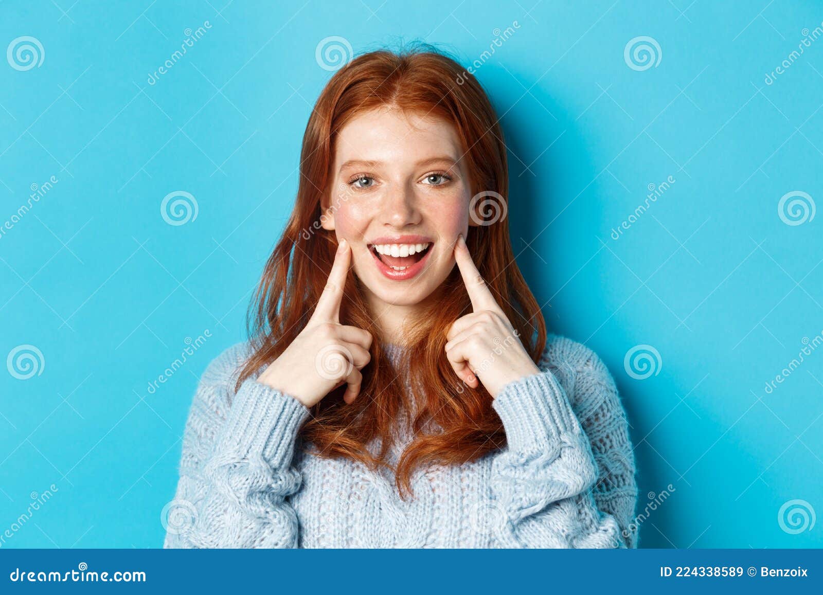 Close-up of Cheerful Teenage Girl with Red Hair and Freckles, Poking ...