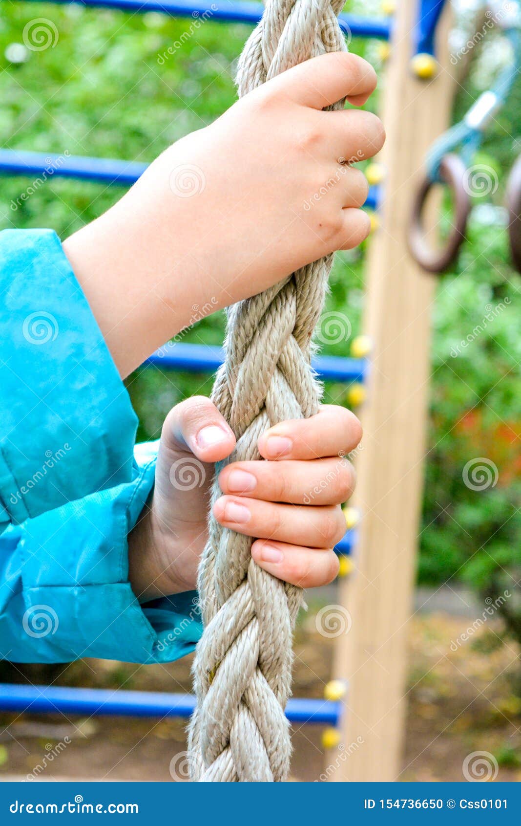 Child Hands Clings To Thick Rope for Climbing of Sports Equipment on  Playground Stock Photo - Image of button, leisure: 154736650