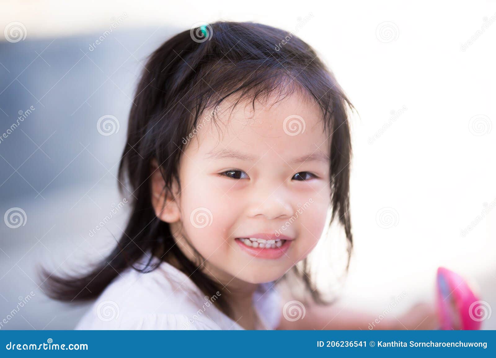 Close Up. Child is Happy Looking at the Camera and Smiles Sweet and ...