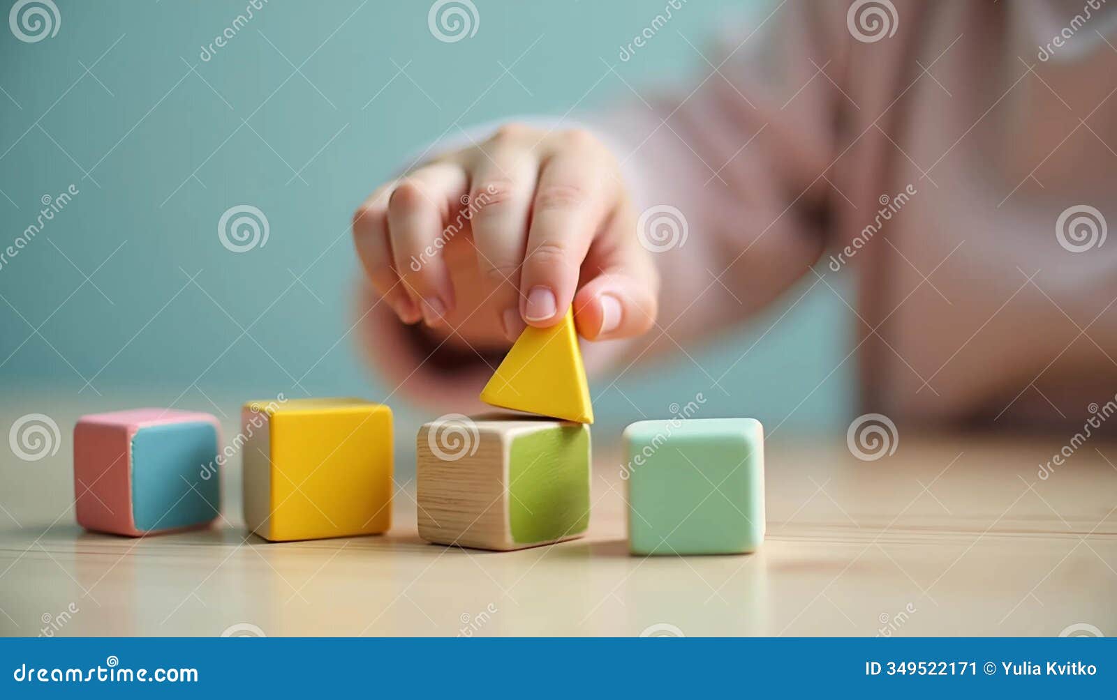 a close-up of a childs hand carefully placing a small colorful block onto a construction set, intricate details of the blocks