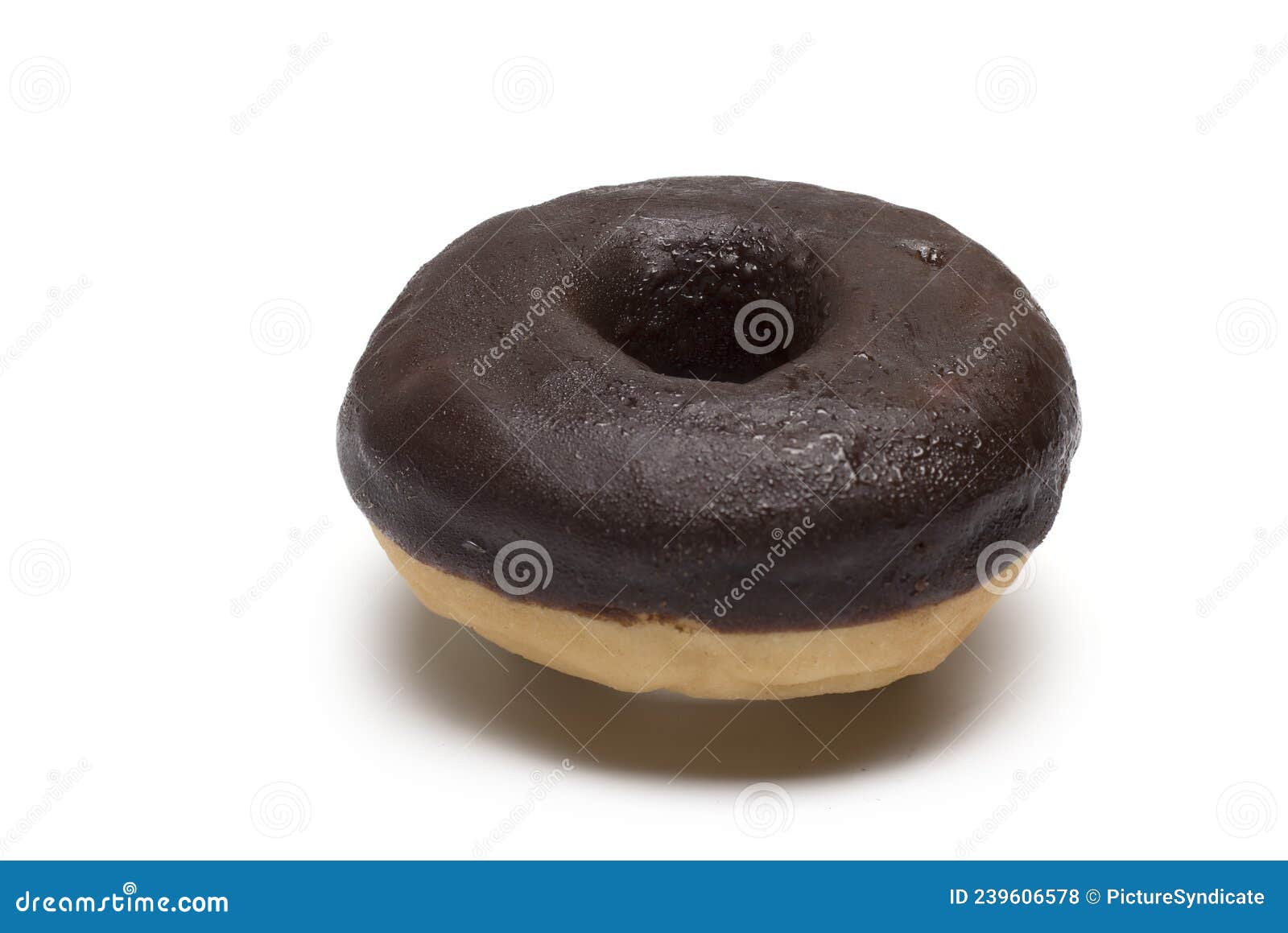 close up of chocolate covered donut on white background