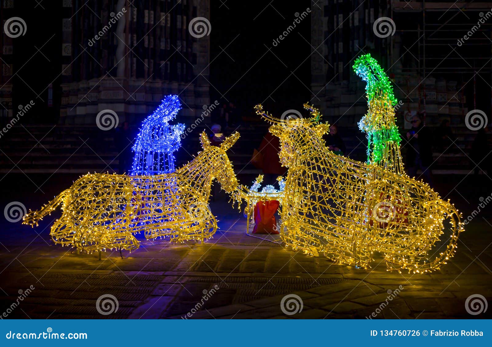 Closeup of Christmas Nativity Scene Illuminated with Colored Lights