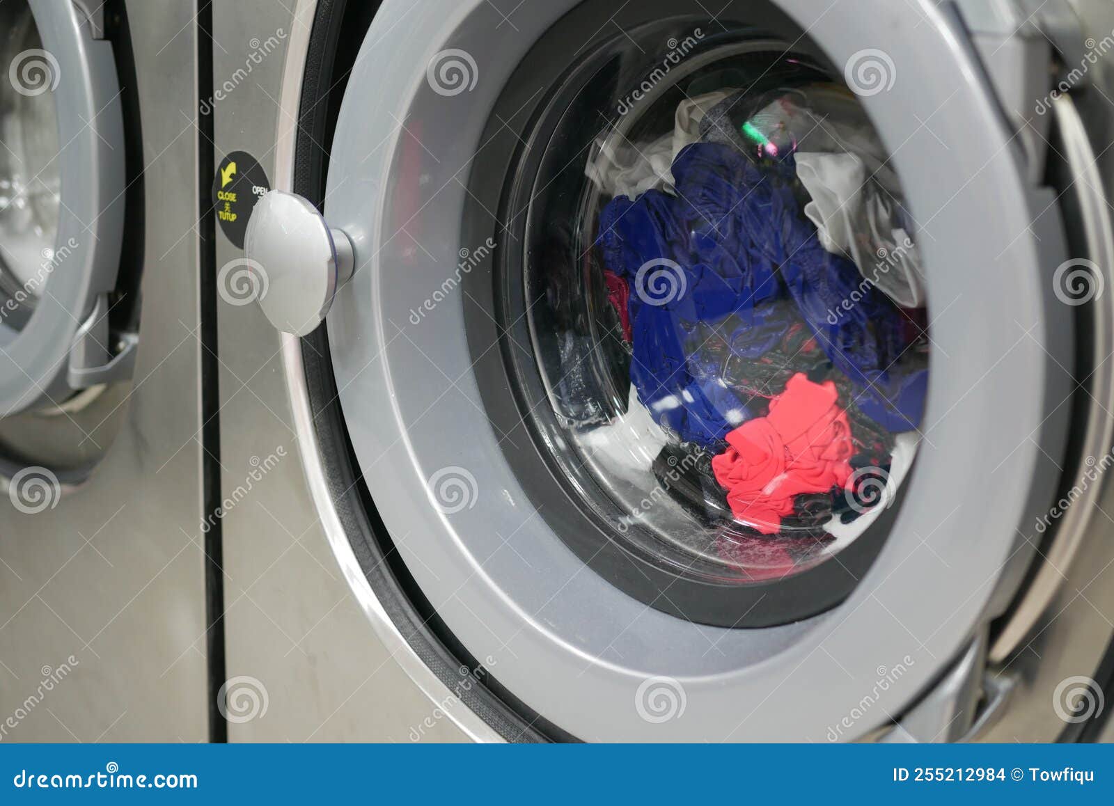Close Up of Cloths in a Washing Machine. Stock Photo Image of laundry