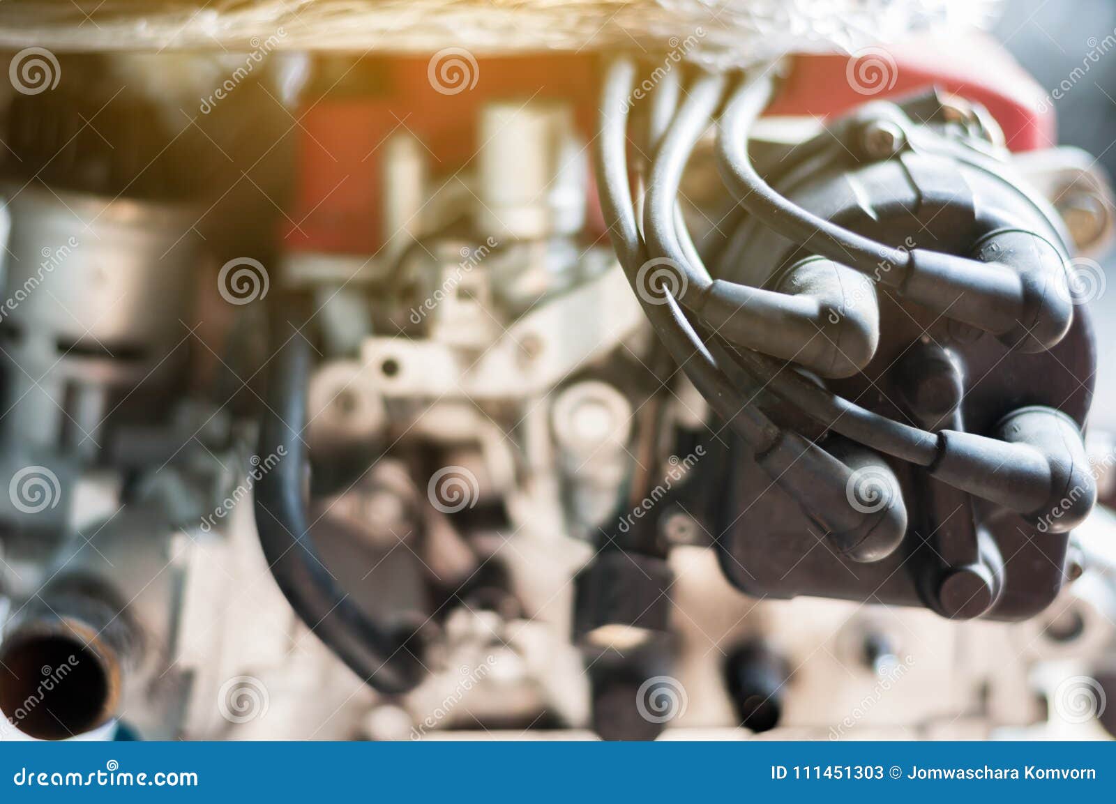 Close Up Coil Distributor Wire Four Cylinder Engine Stand on Car with