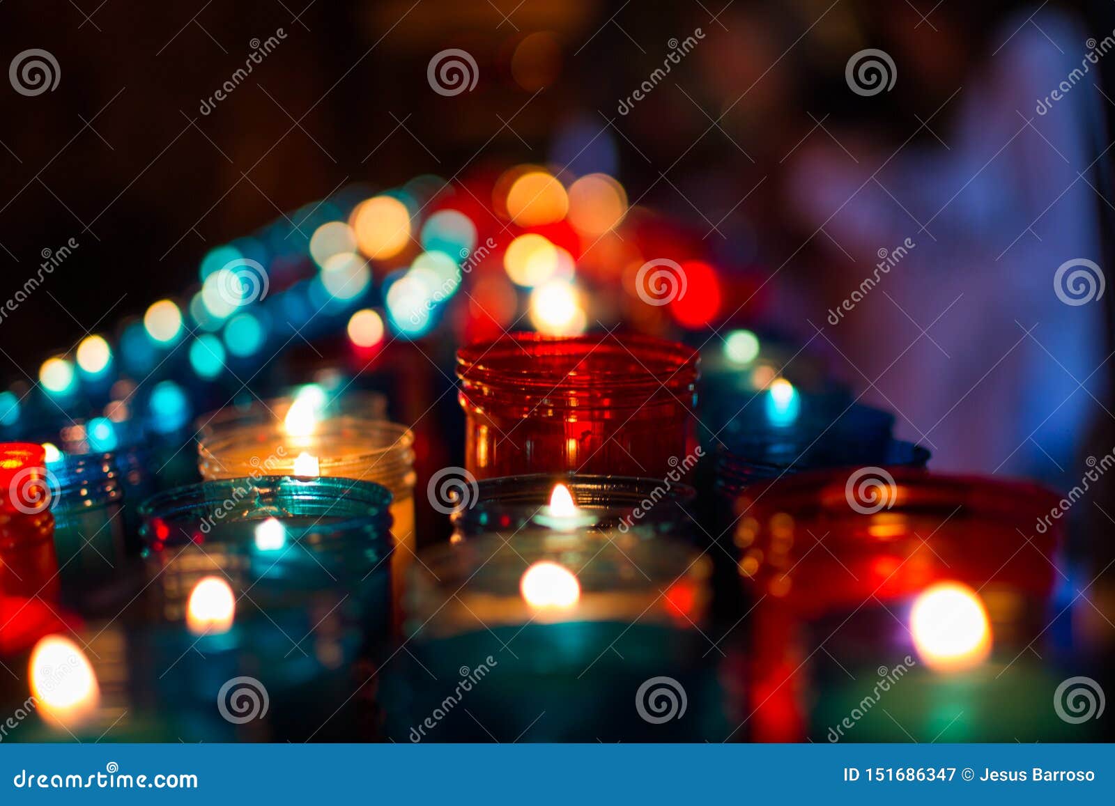 close up of colorful candles in a dark spiritual scene. commemoration, funeral, memorial. religious ism