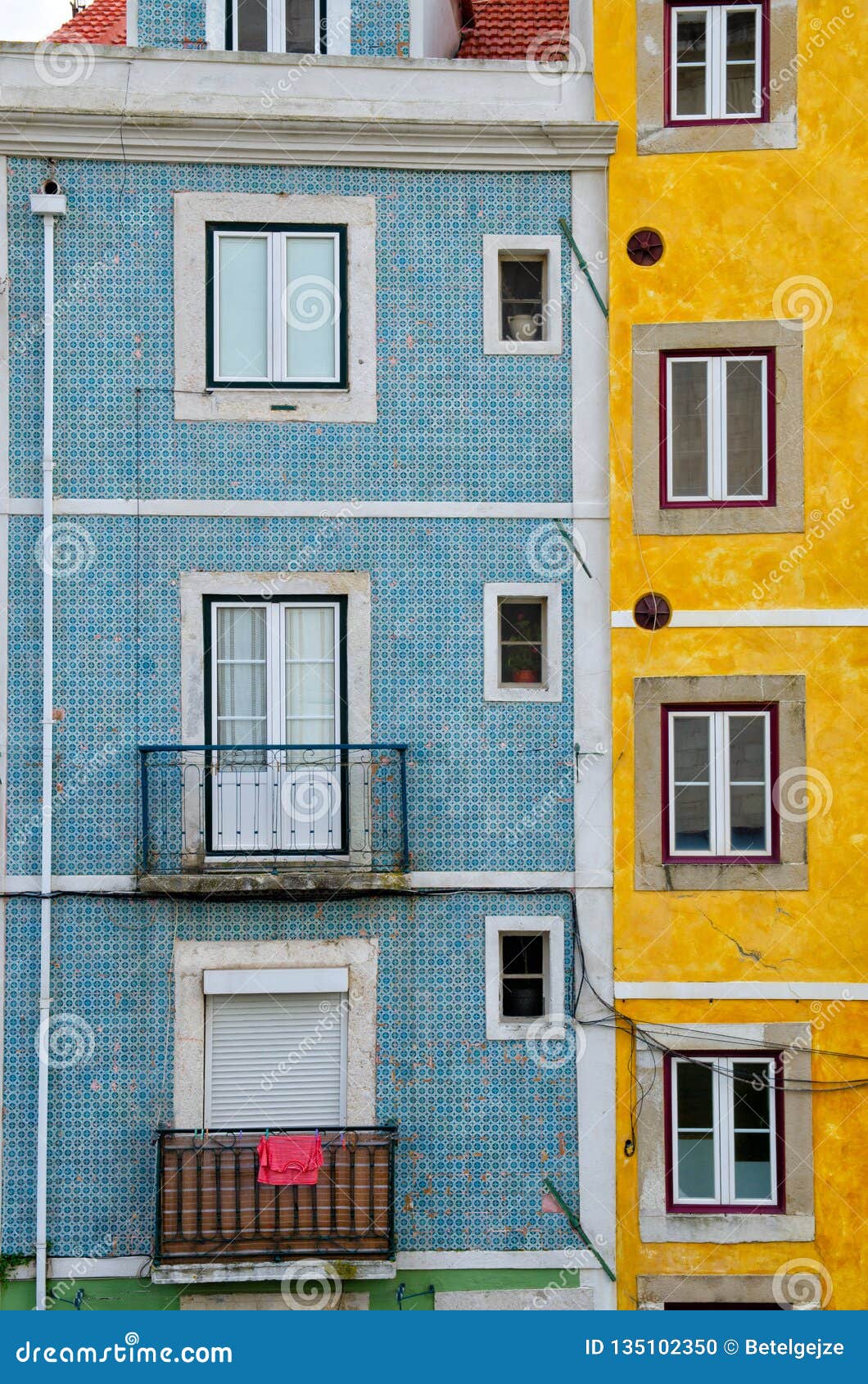 close up of colorful old houses and windows. lisbon, portugal. color blocks architecture vertical background