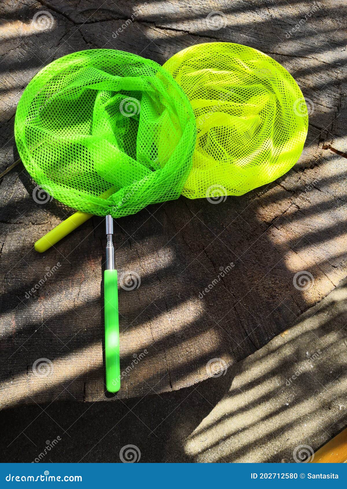 https://thumbs.dreamstime.com/z/close-up-colourful-children-s-fishing-nets-rock-pooling-yellow-green-202712580.jpg