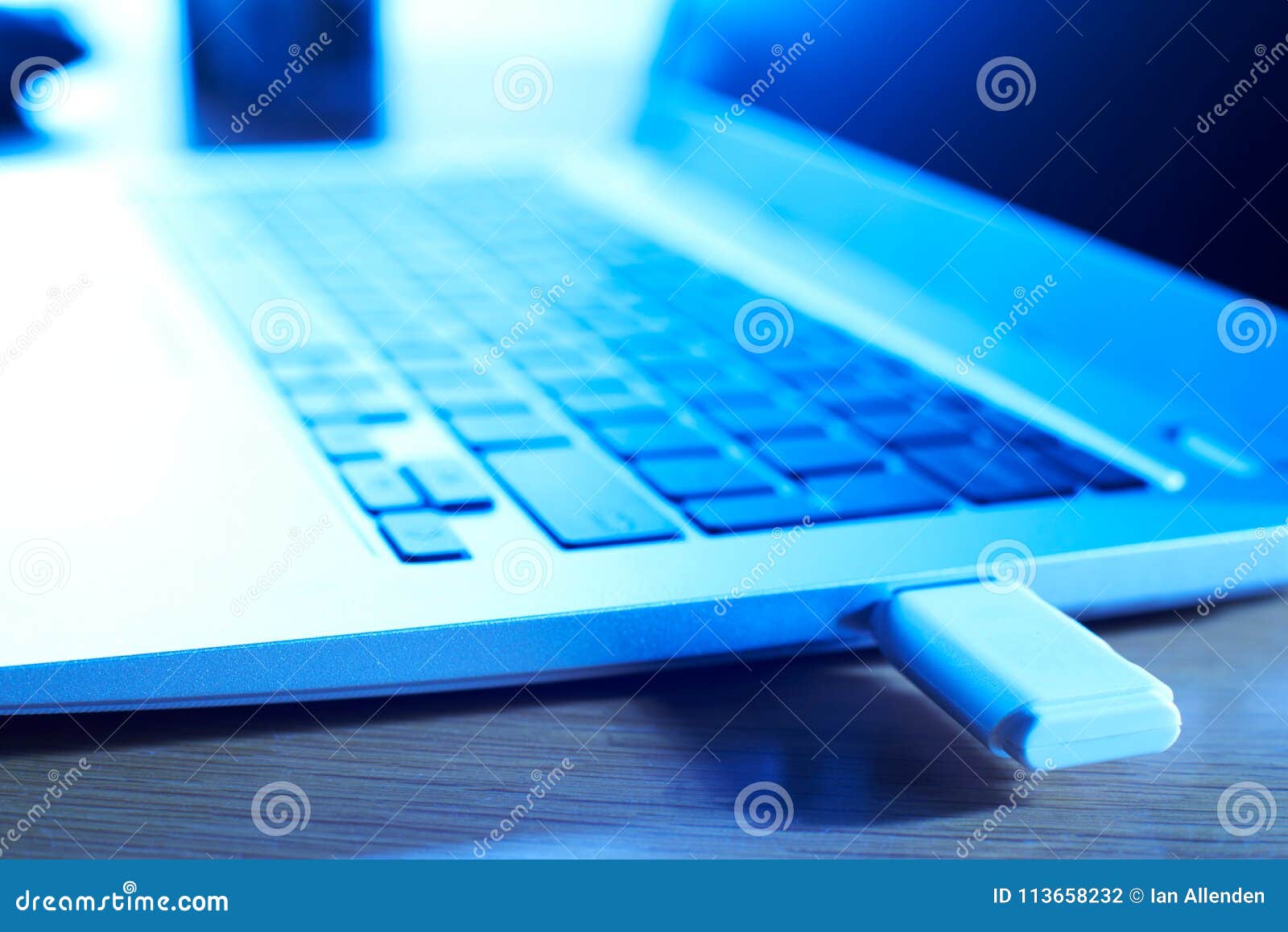 close up of computer data being transfered from laptop to portable drive