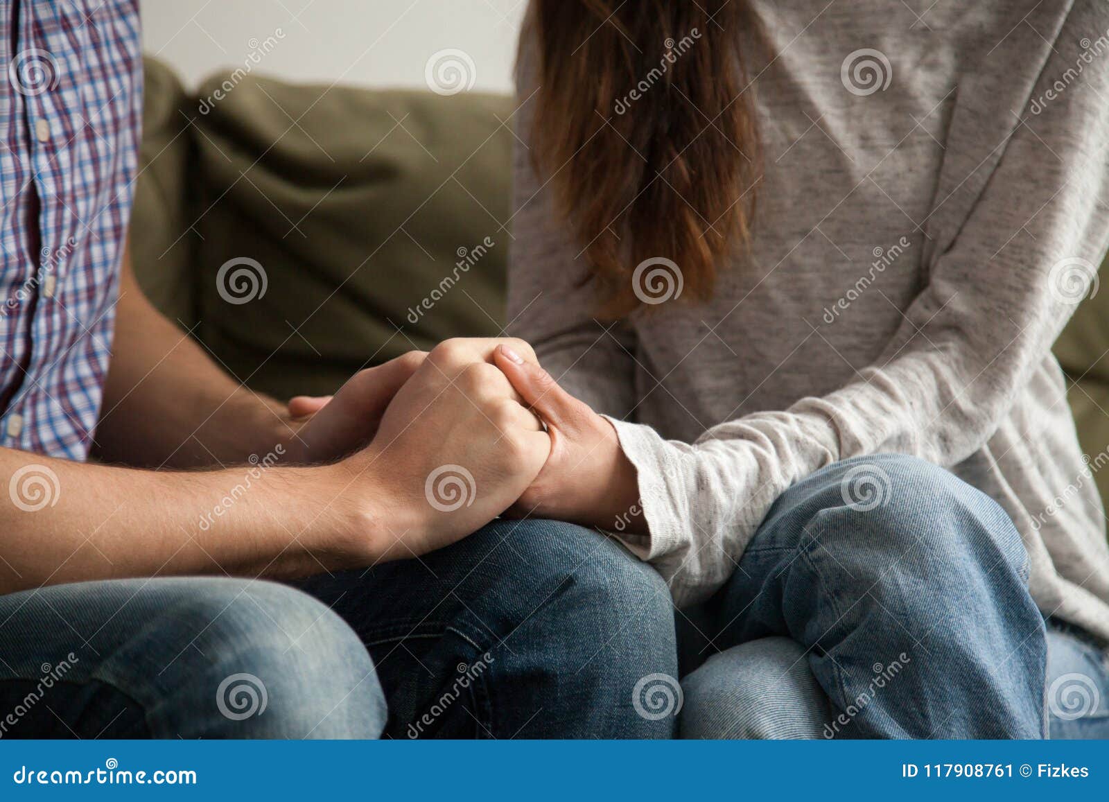 close up of couple holding hands, support and understanding conc
