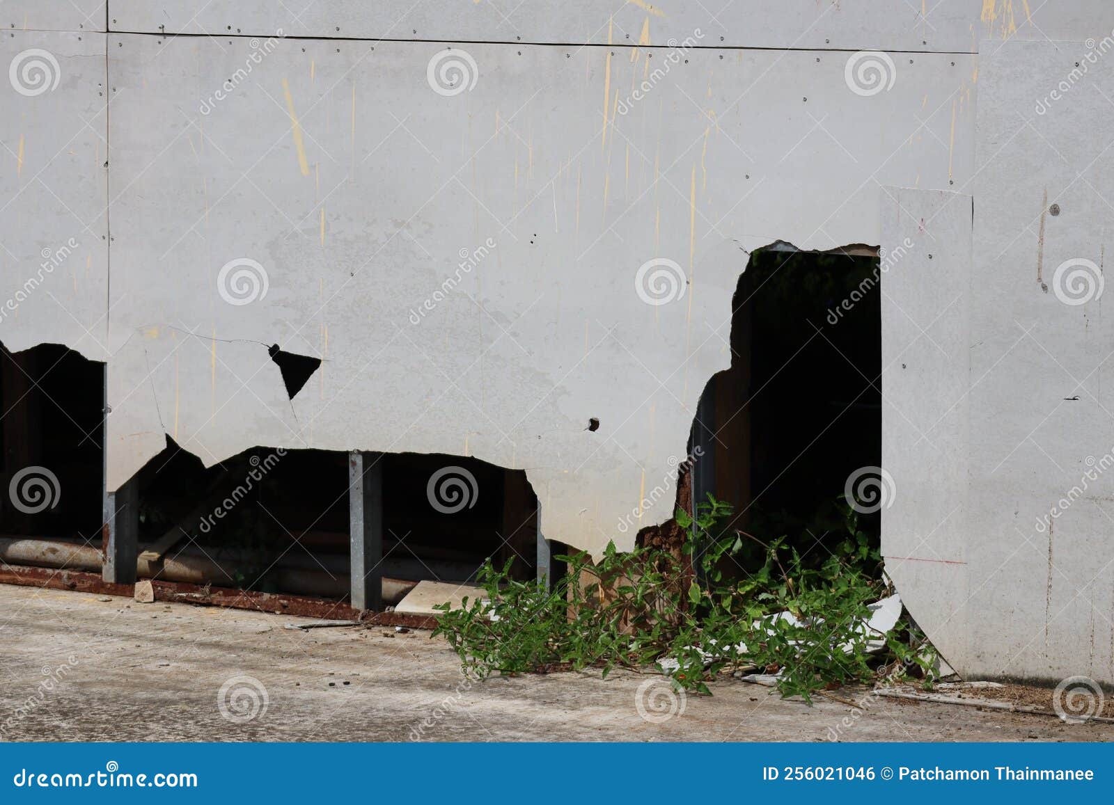 Closeup of Cracks in the Base of an Old Building with Cracks and