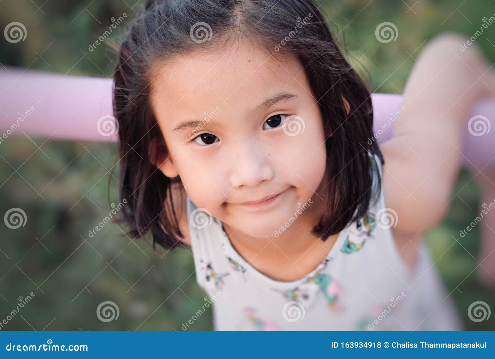 Close Up of Cute Asian Child Girl is Smiling Happily in the Park. Stock ...