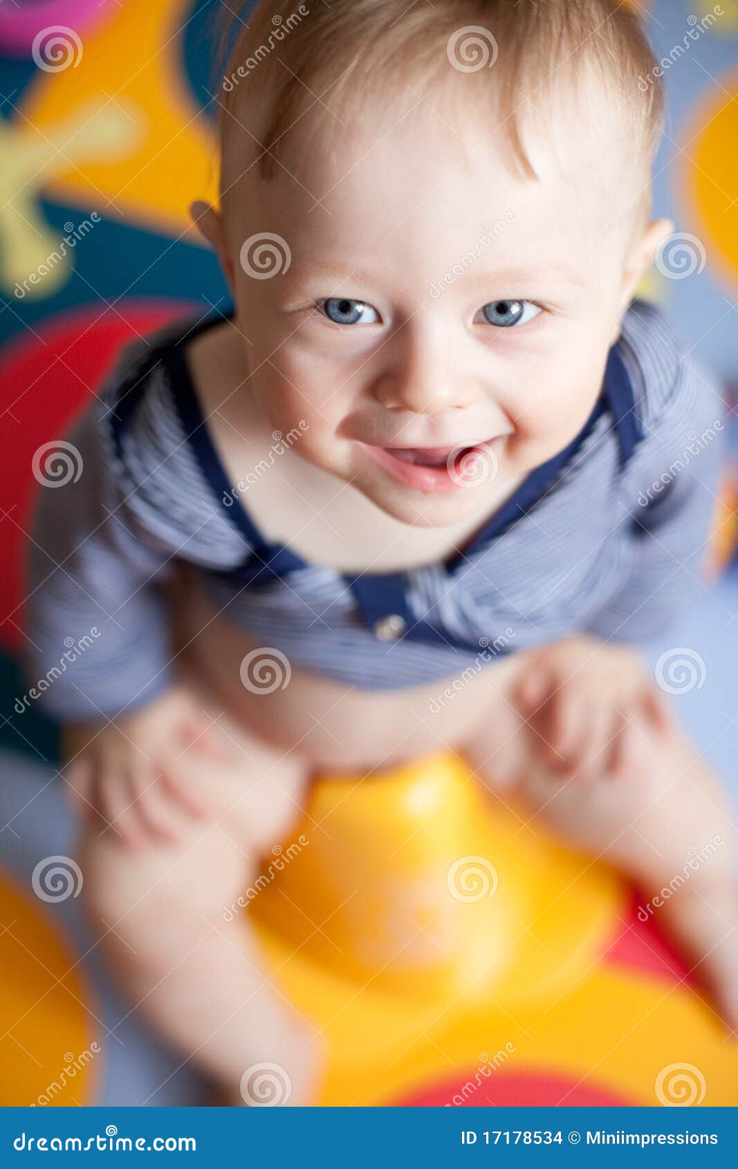 Closeup Of A Cute Babyboy Sitting On A Potty Stock Photo