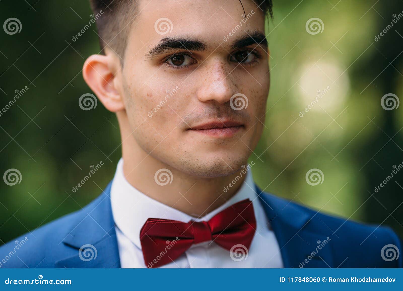 A Close-up Dark-haired Guy with Thick Eyebrows, Brown Eyes and Freckles Gazes Intently at the Camera. a Man in a Blue Stock Photo - Image of gentleman, natural: 117848060 A Close-up Dark-haired Guy with Thick Eyebrows, Brown Eyes and Freckles Gazes Intently at the Camera. a Man in a Blue Stock Photo - Image of gentleman, natural: 117848060