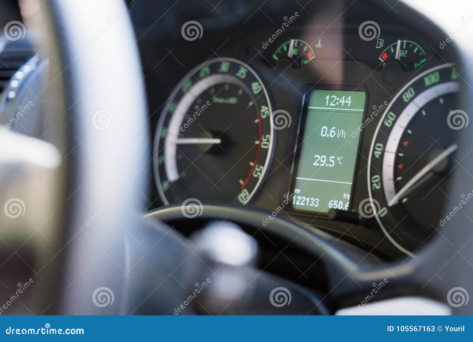 Close Up Dashboard of a Modern Car Mileage and Temperature Stock Image