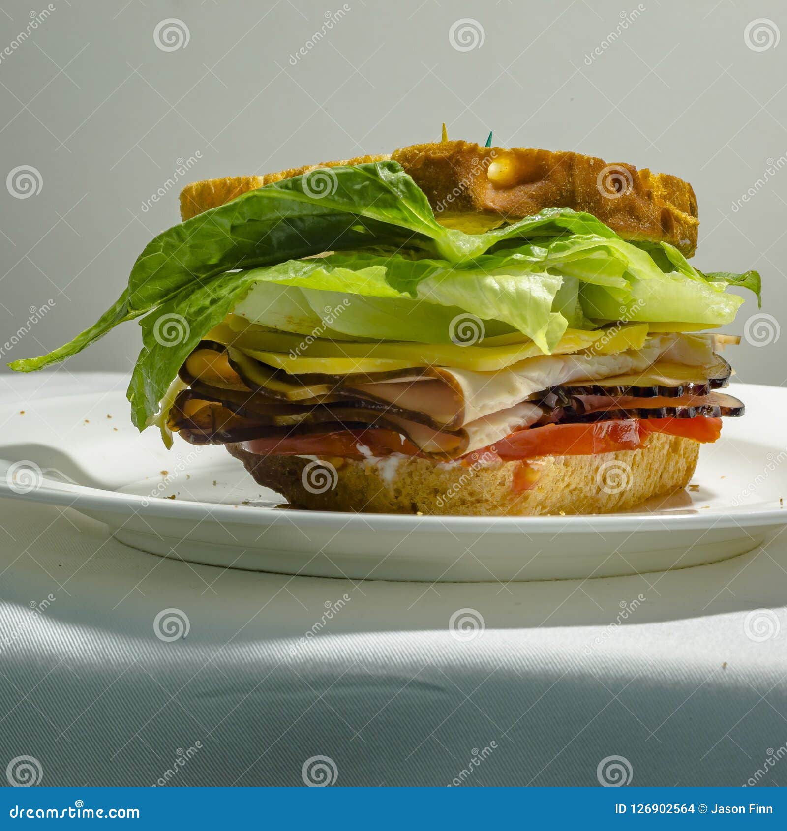 Close Up Of Deli Sandwich With Appetizing Filling Stock Photo Image