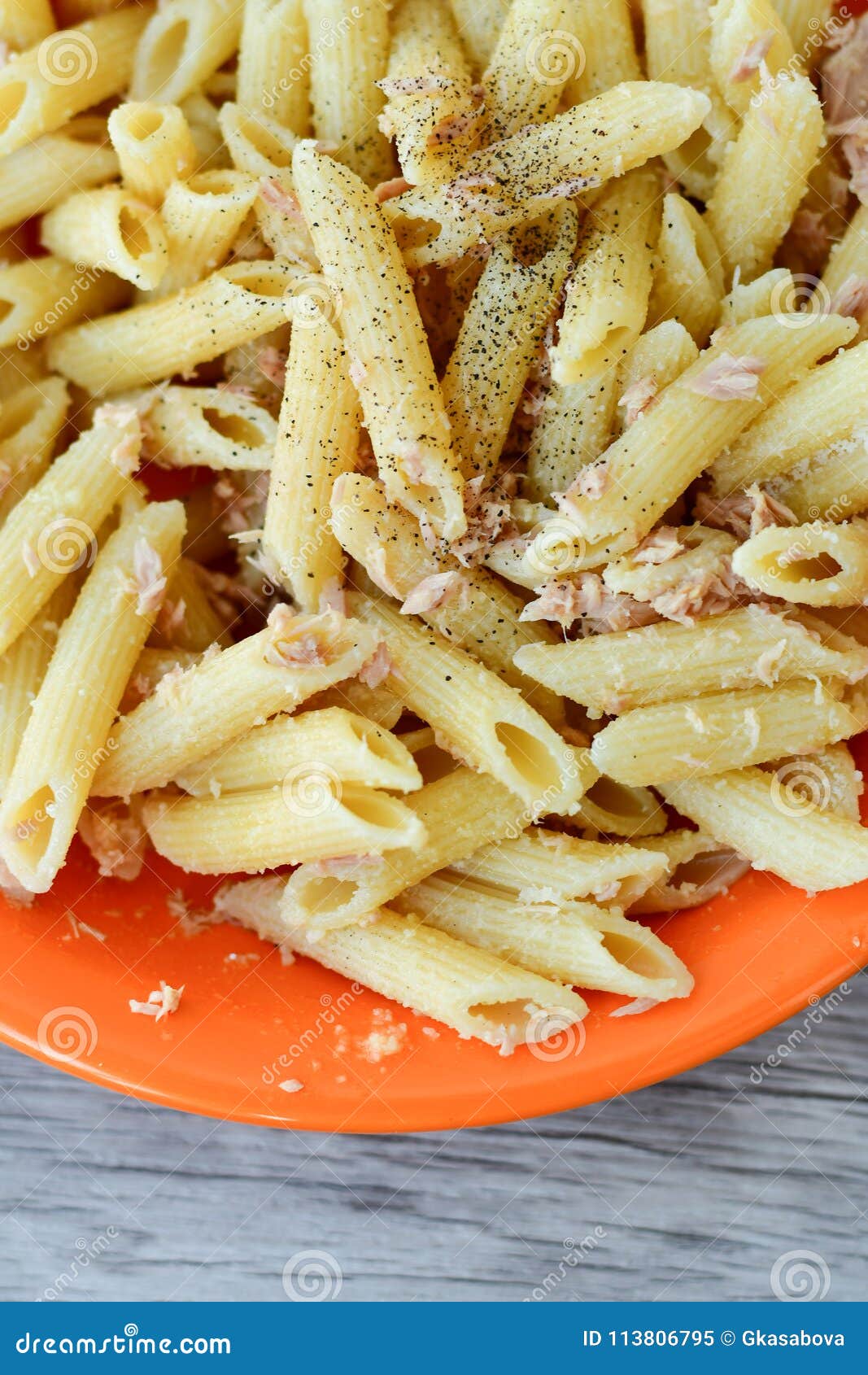 Penne with tuna fish stock image. Image of grated, basil - 113806795