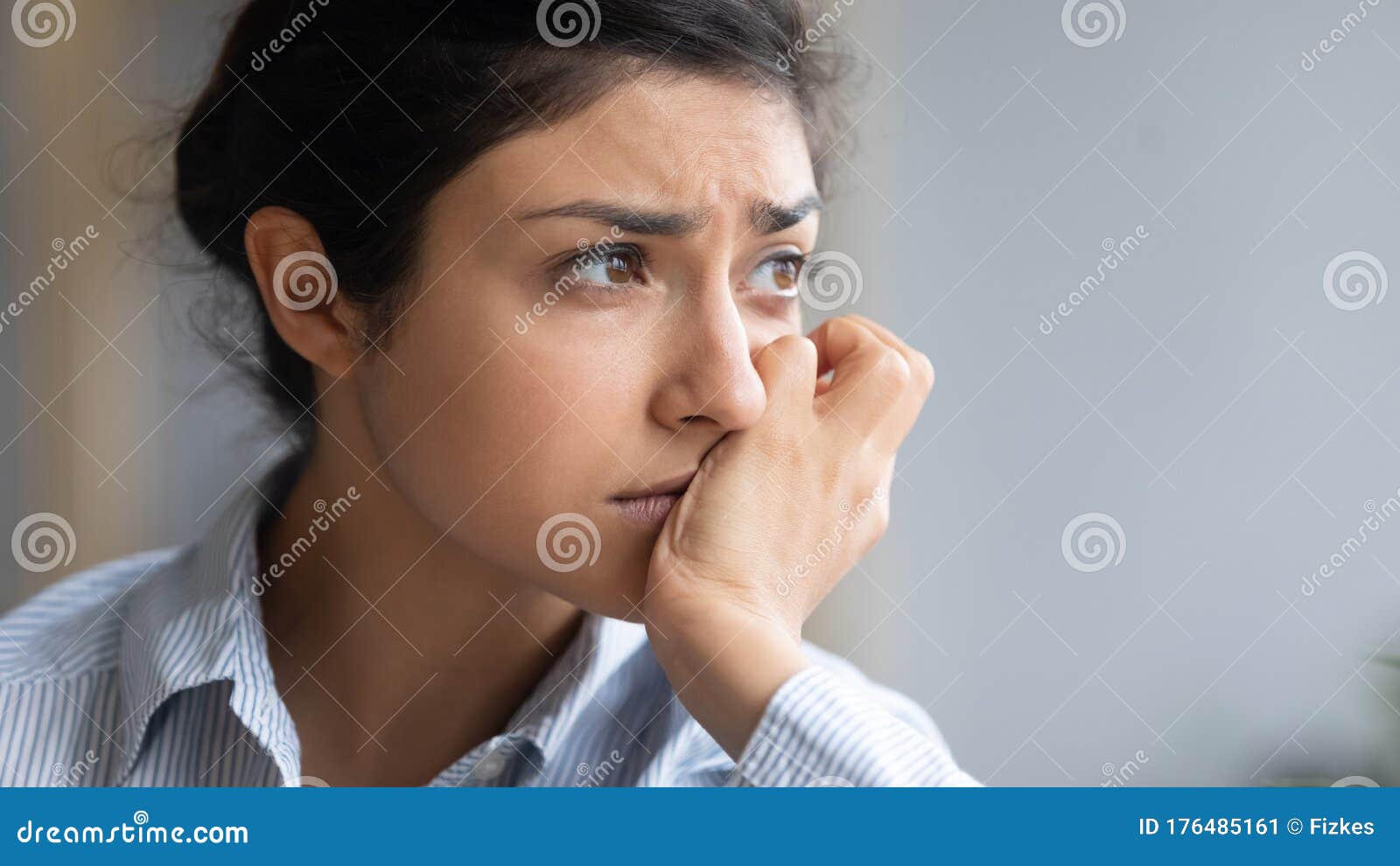 close up depressed unhappy indian woman thinking about problems