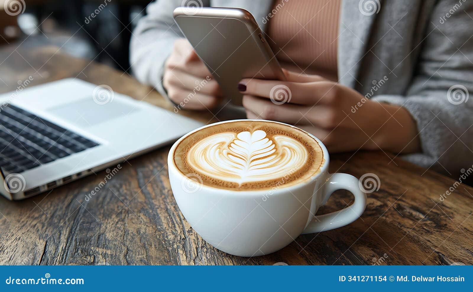 close-up detail of intricate latte art leaf pattern with digital work setup