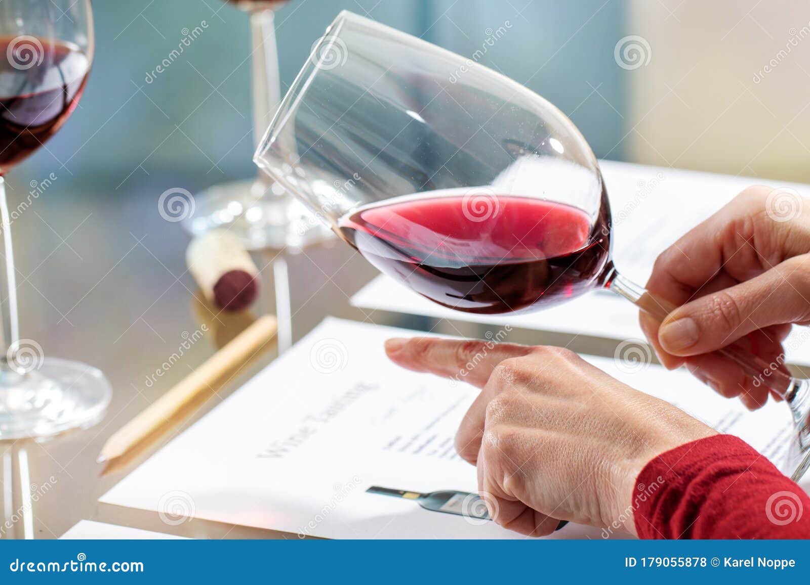 wine steward evaluating red wine density