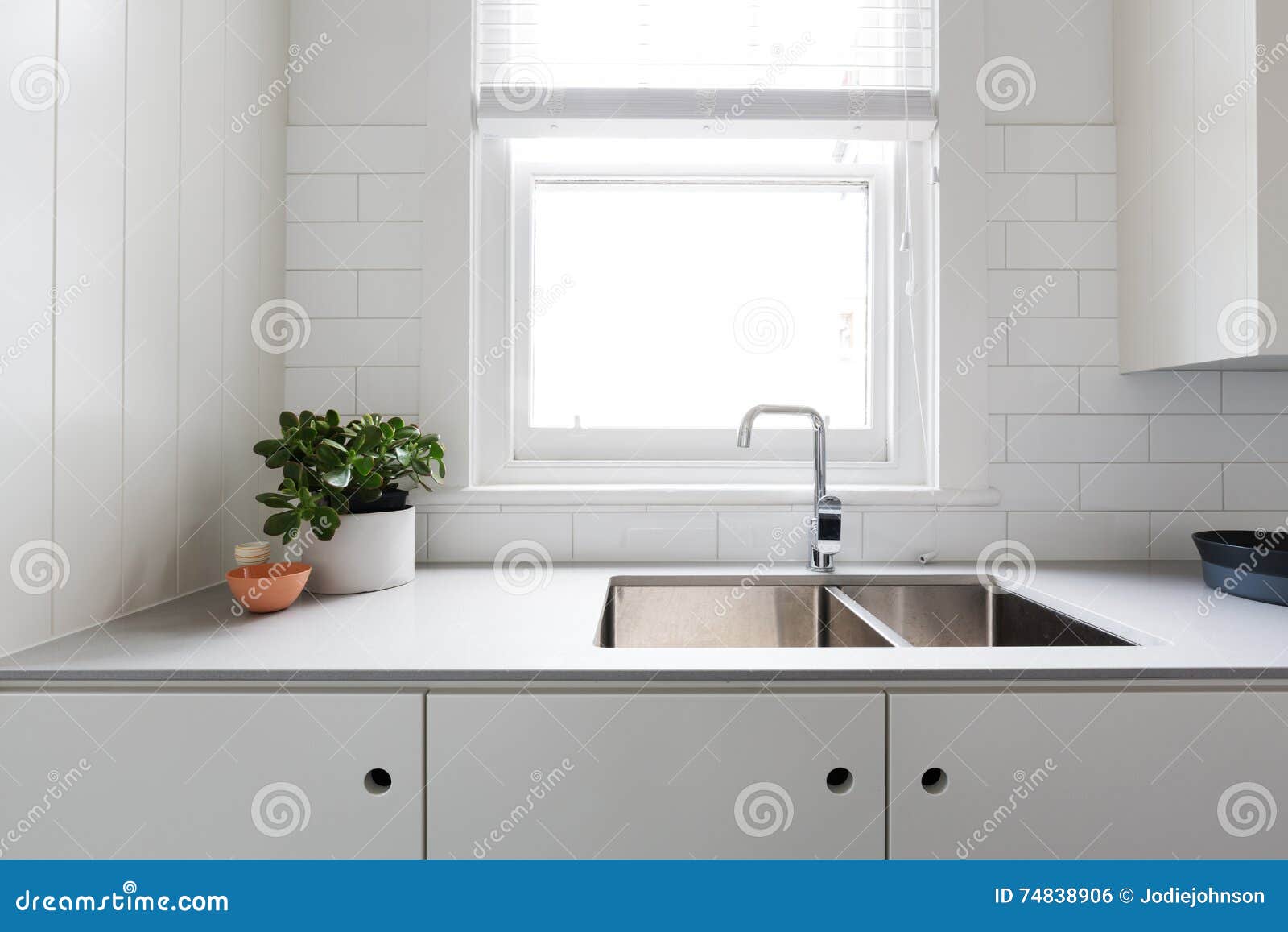 close up details of contemporary white kitchen with subway tiles