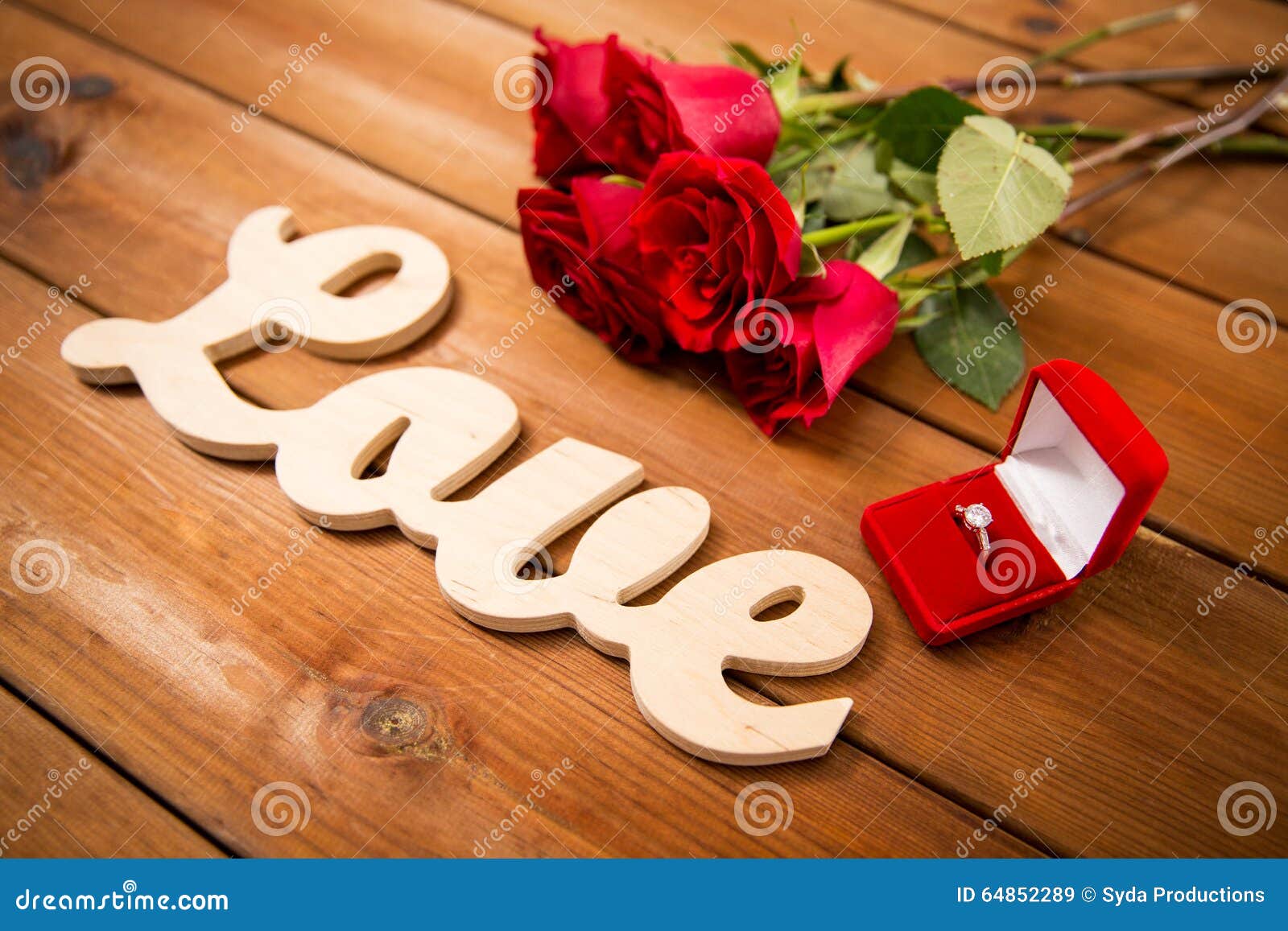 Close Up Of Diamond Ring, Red Roses And Word Love Stock 